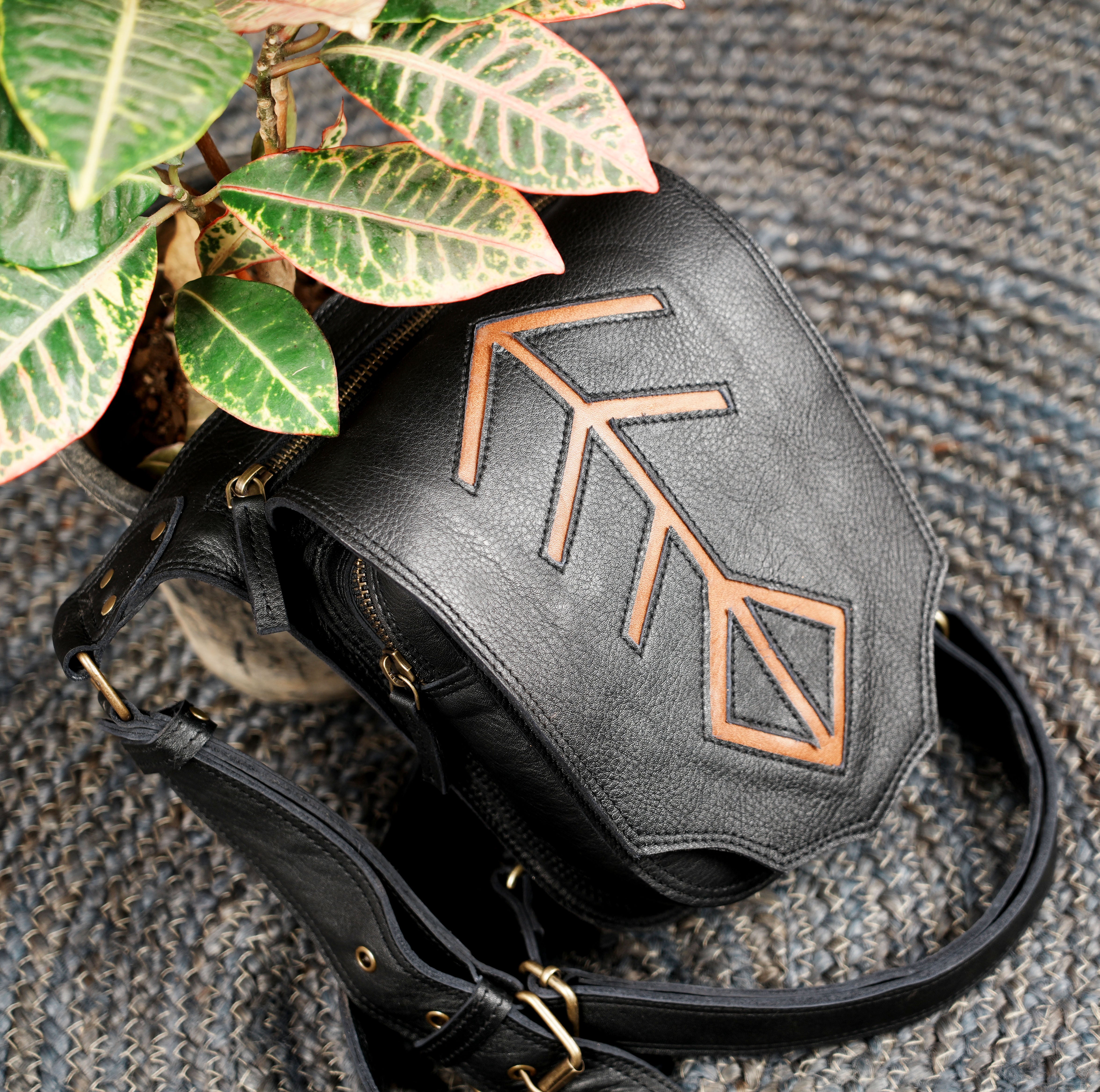 Adjustable leather waist belt with leg strap and metal hardware