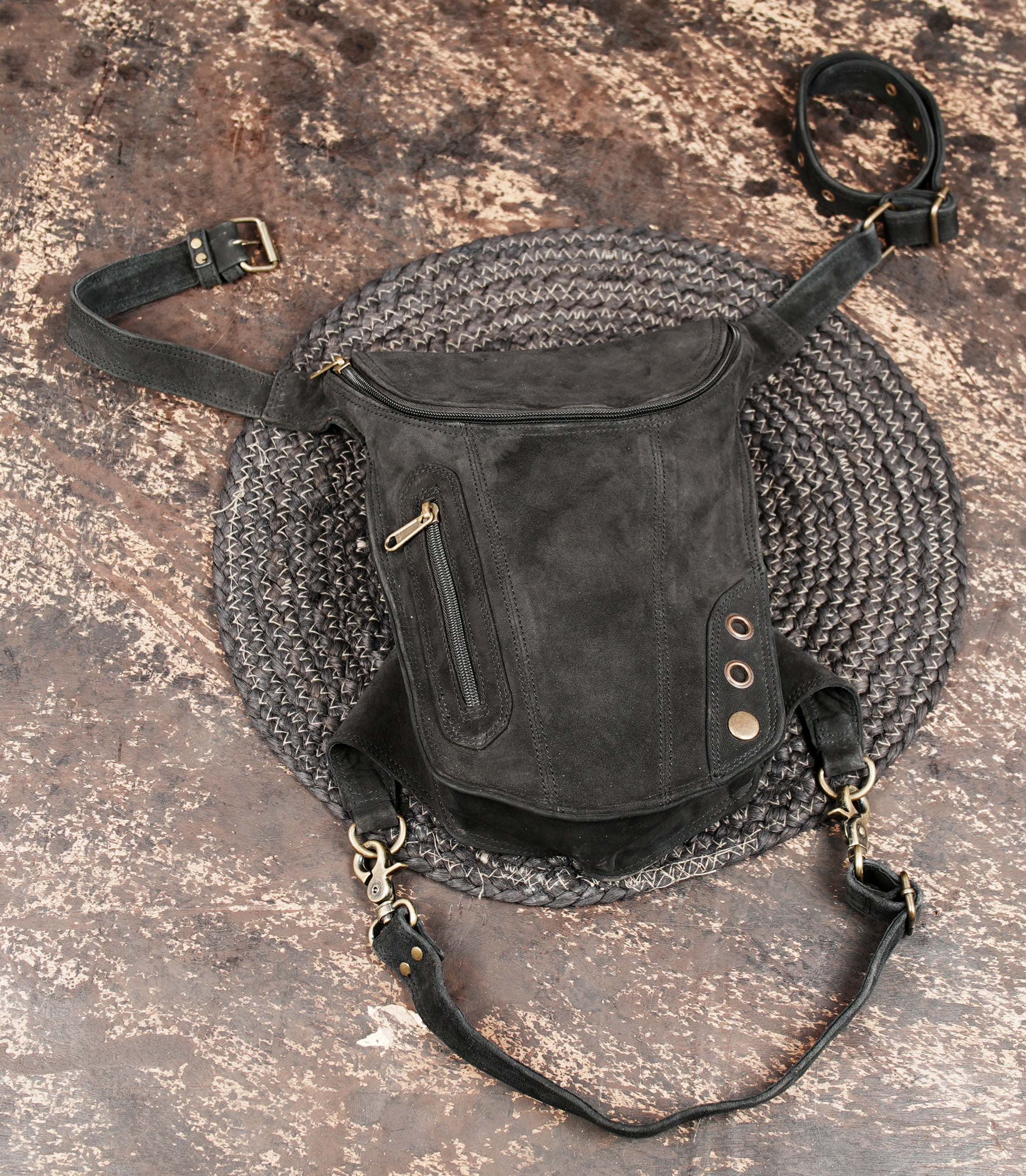 Adjustable black leather thigh belt with metal hardware