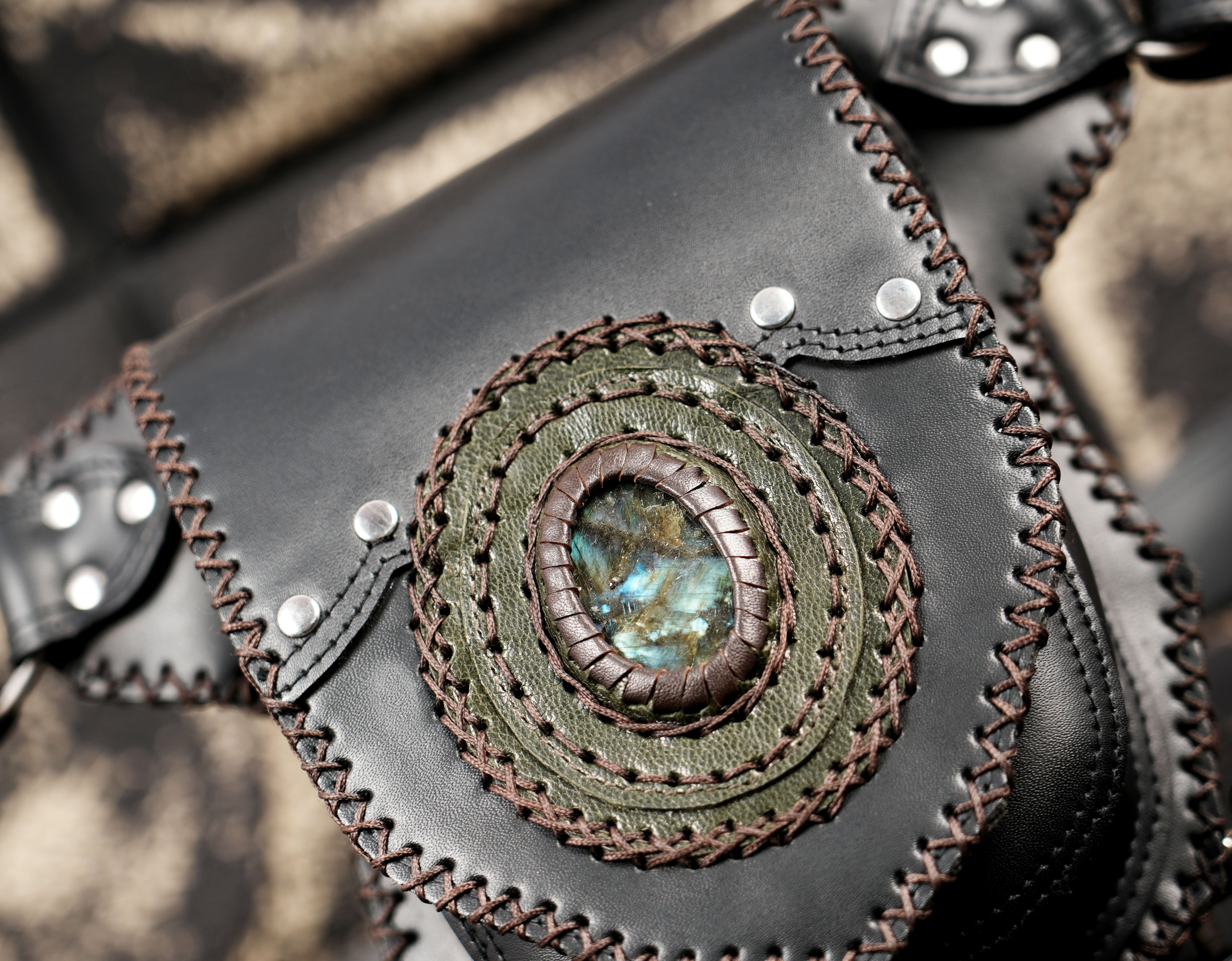 Adjustable black leather thigh belt with artisan stone detailing