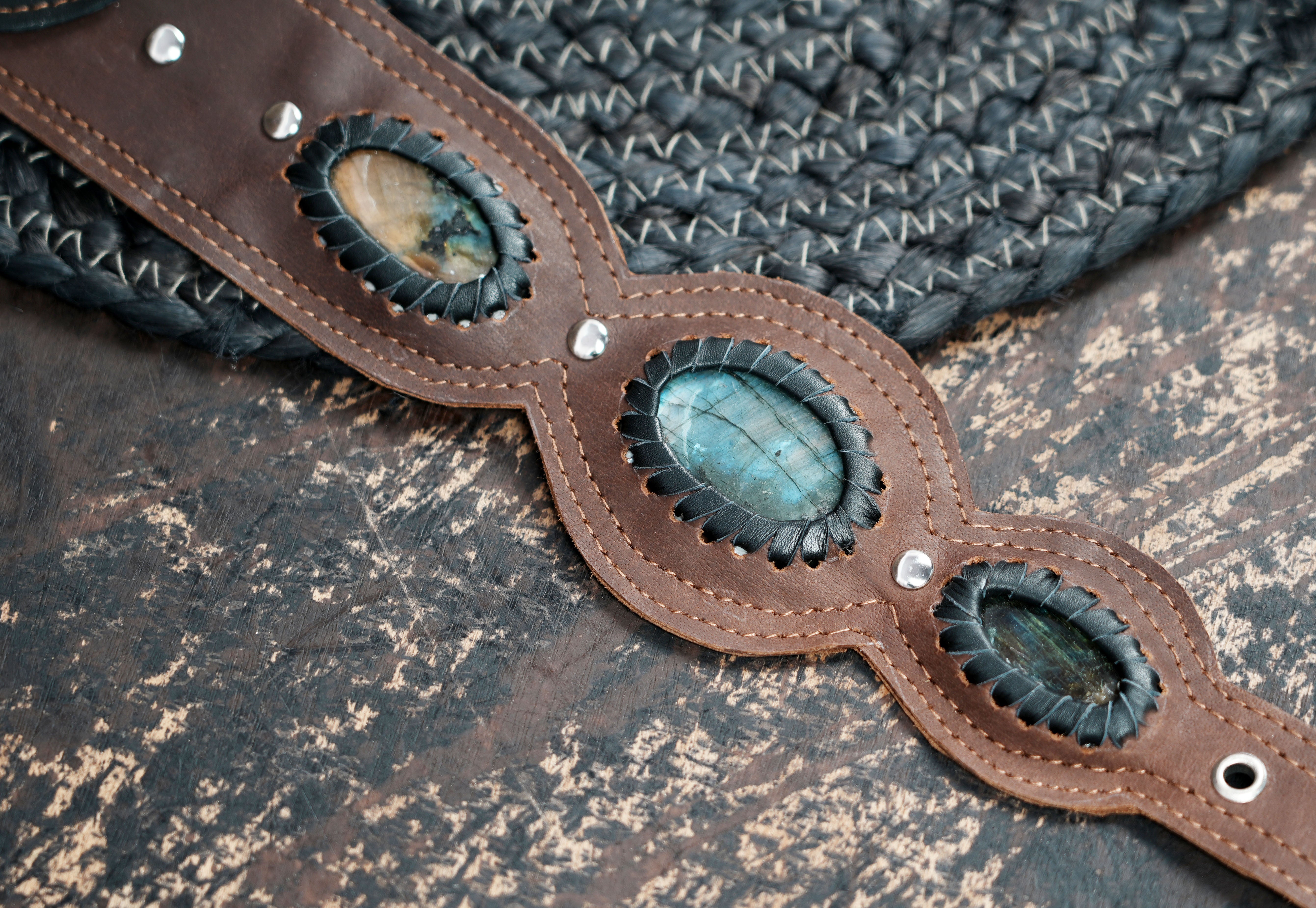 Ethnic leather holster bag with tribal patterns and gemstone centerpiece