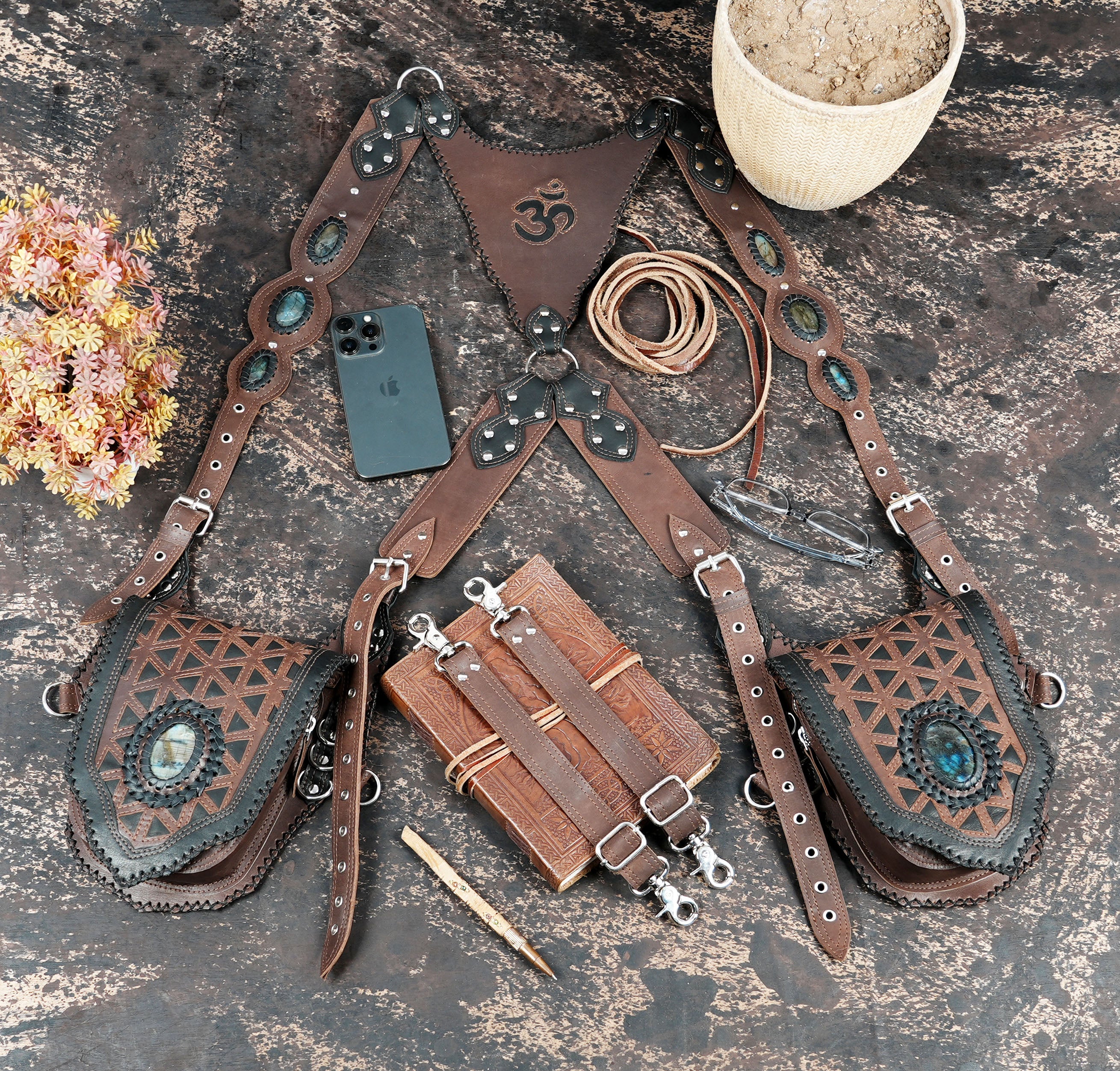 Brown leather shoulder holster with braided back panel and metal hardware