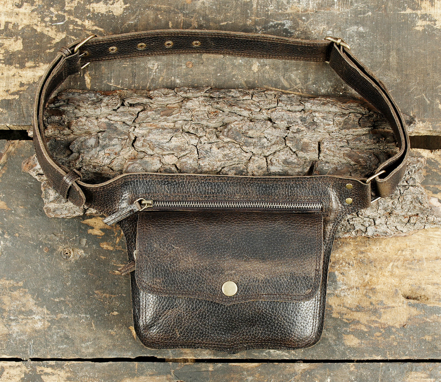 Leather waist belt with snap button pocket and metal buckle