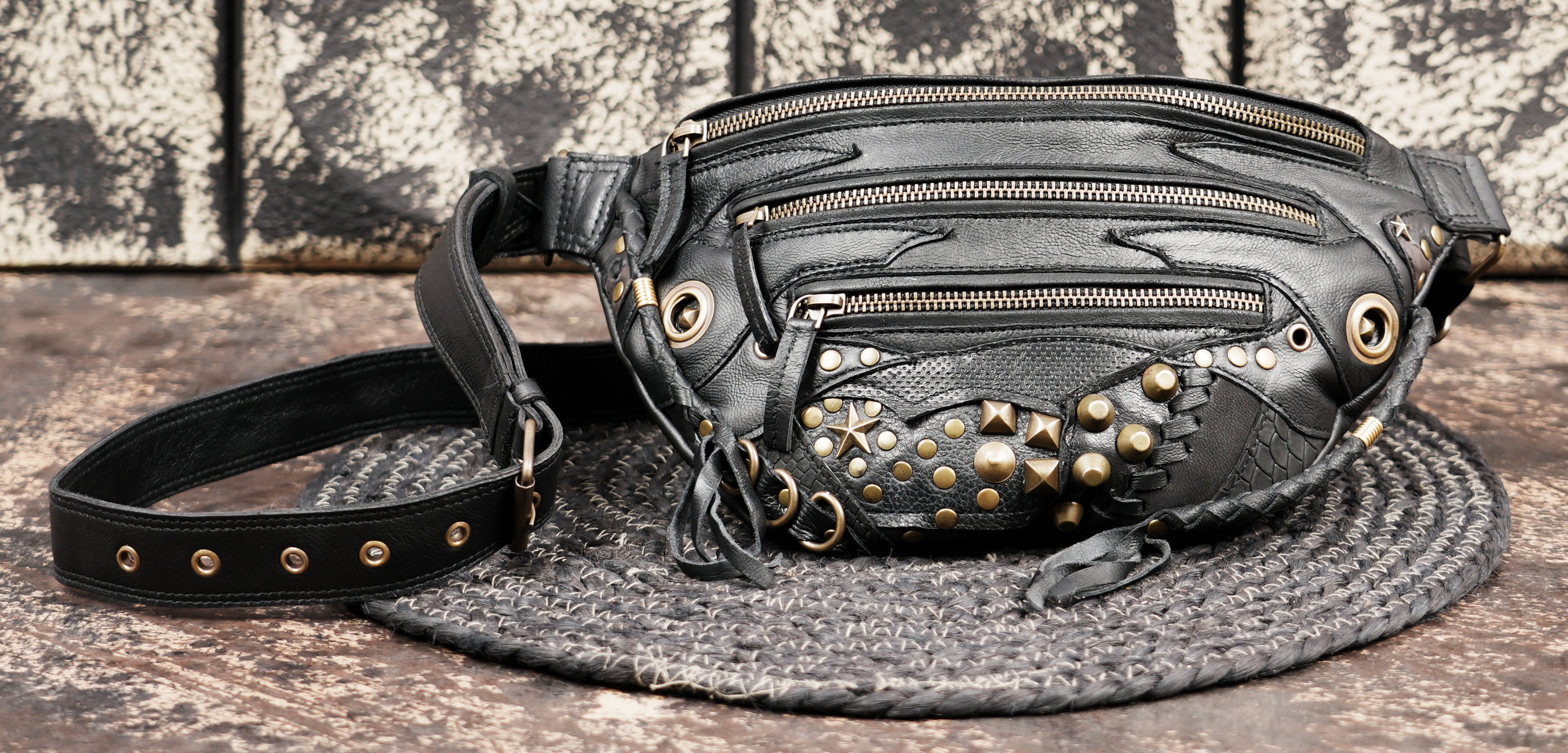Gothic style leather shoulder belt bag with metal studs and rings