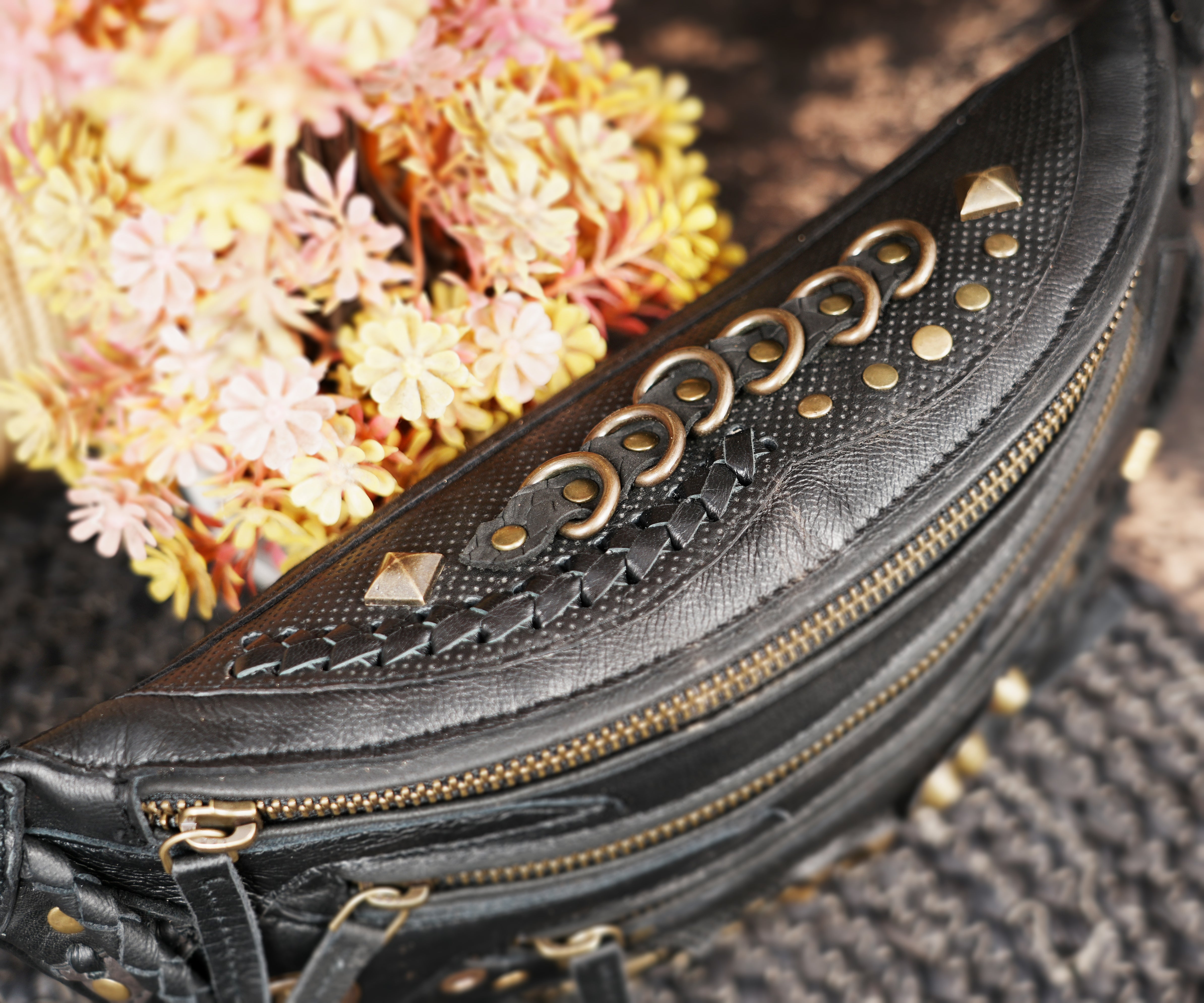 Artisan crafted leather shoulder belt with rivets and zip closure