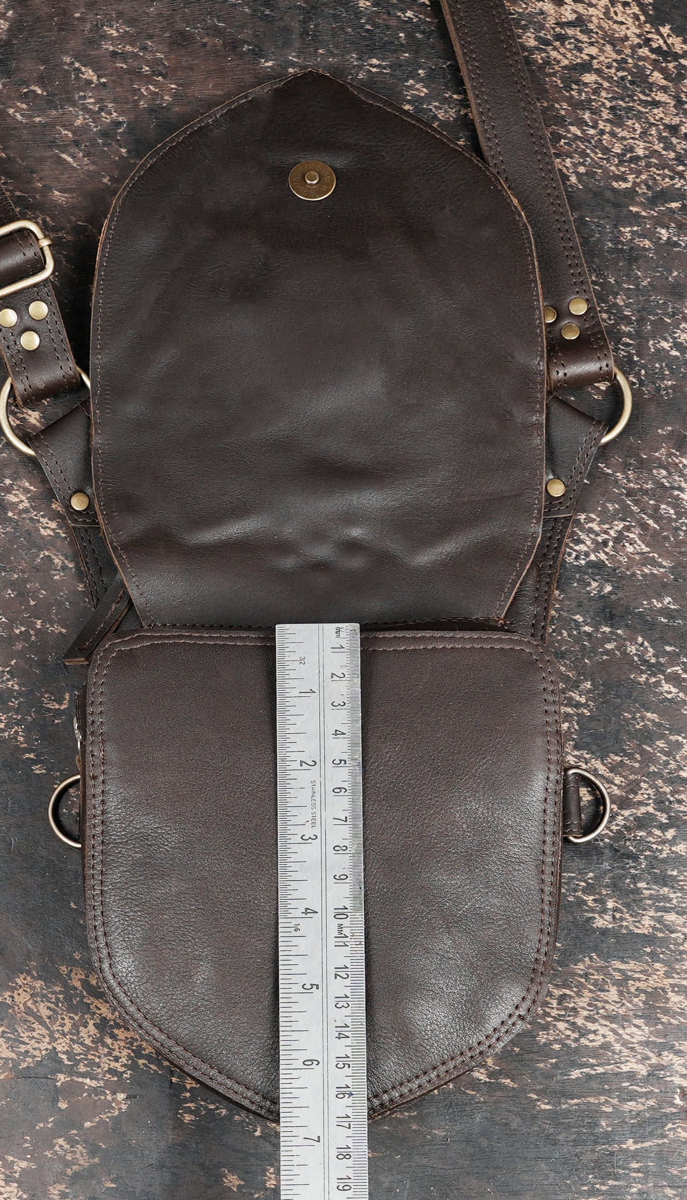 Handmade leather harness bag with secure zipper closures