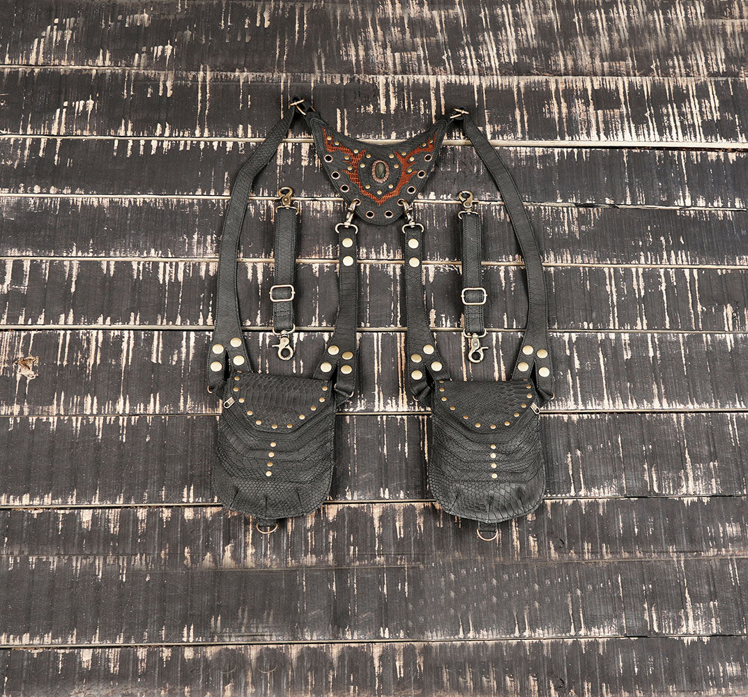 Handcrafted black leather shoulder holster with dual pouches and metal rivet detailing