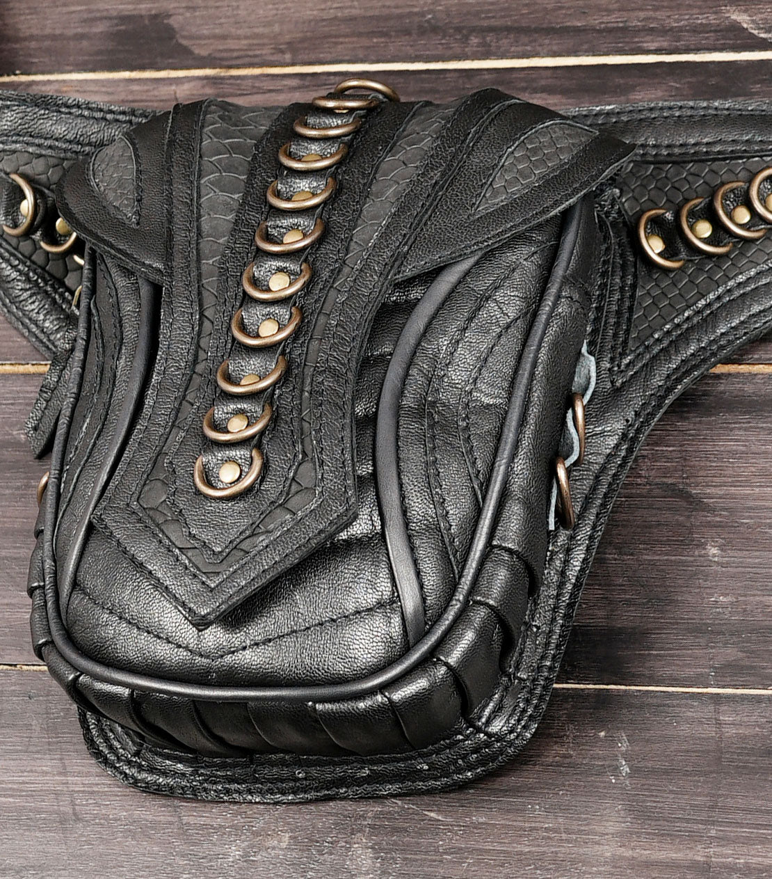 Genuine leather waist belt bag with adjustable buckle and metal rings