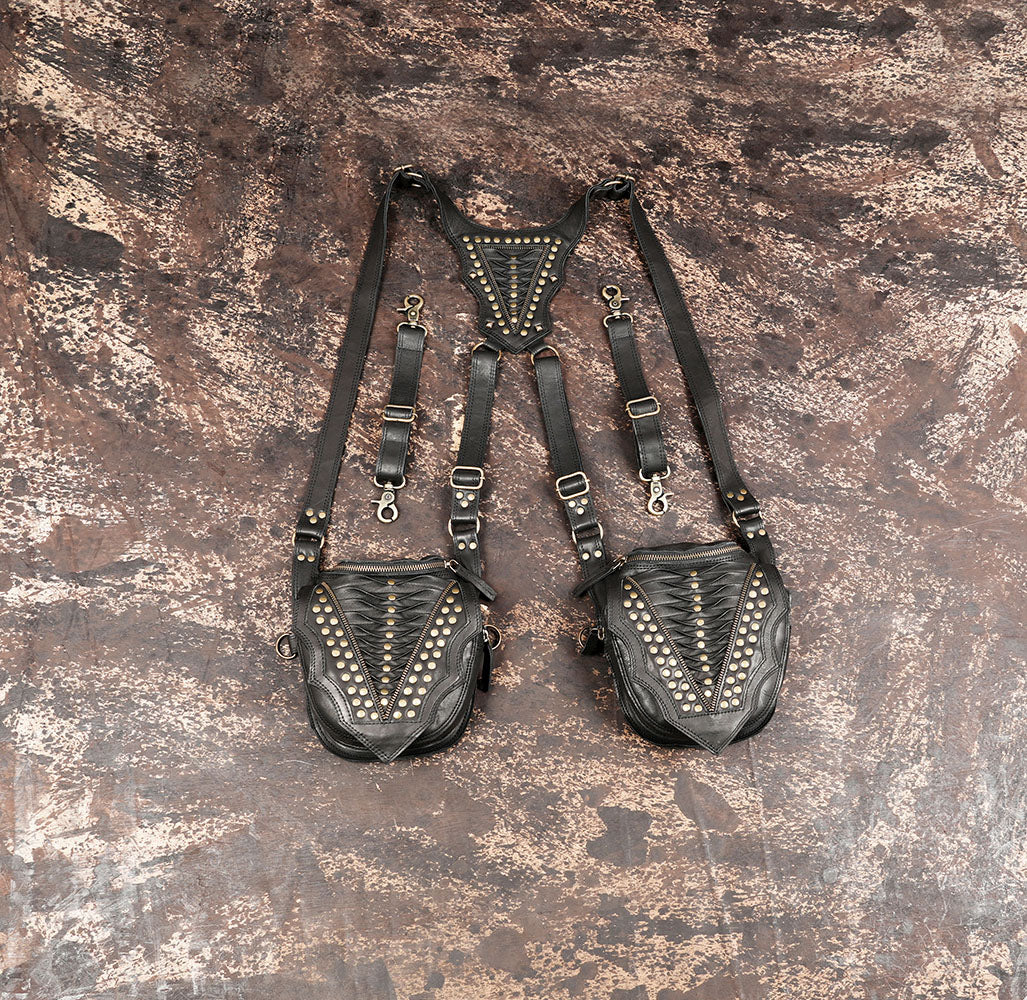 Handmade black leather shoulder holster with dual pouches and brass studs