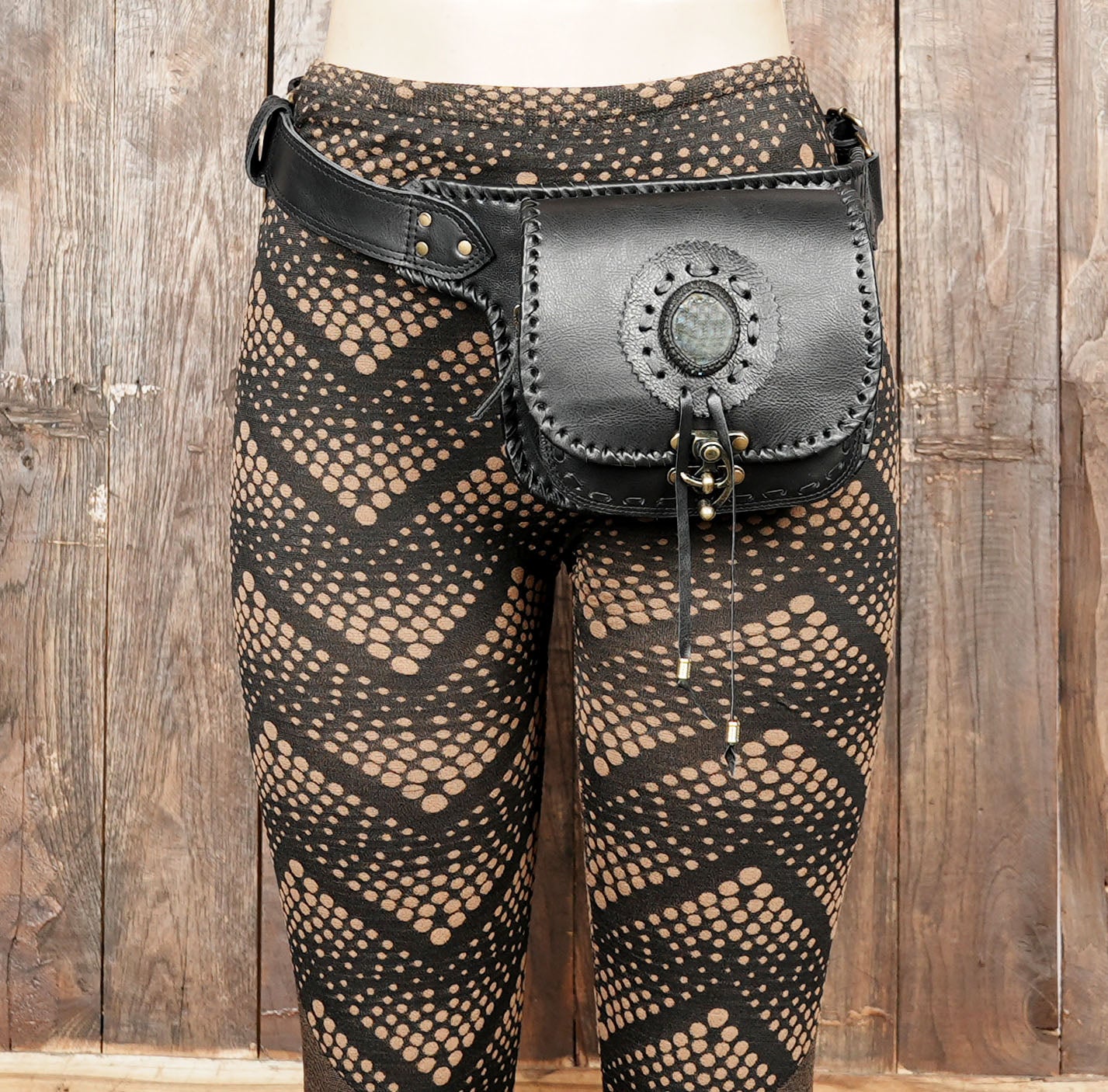 Handcrafted leather belt pouch with durable stitching and brass fittings