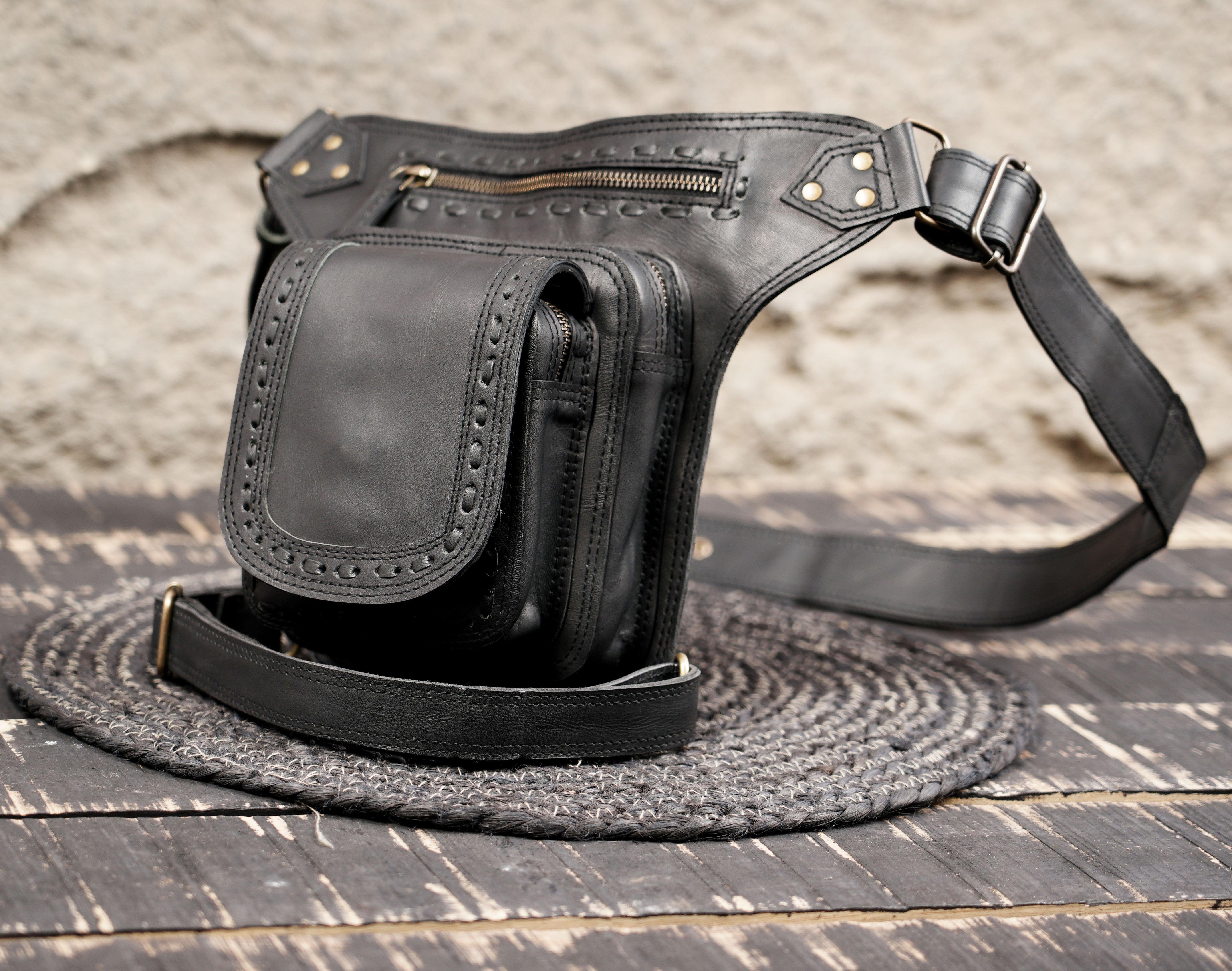 Leather waist thigh belt featuring sturdy stitching and metal hardware