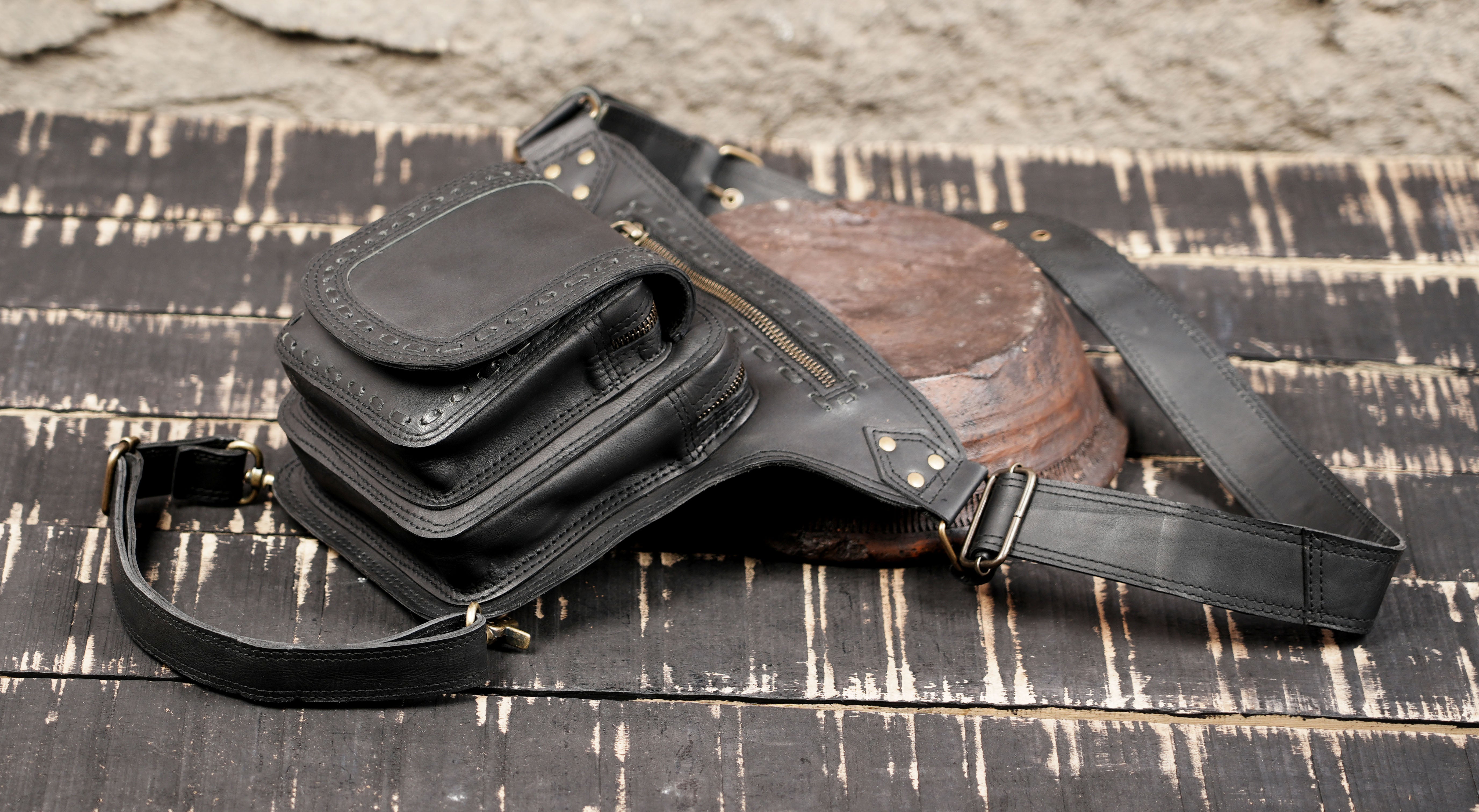 Black leather waist thigh pouch for phone, wallet, and essentials