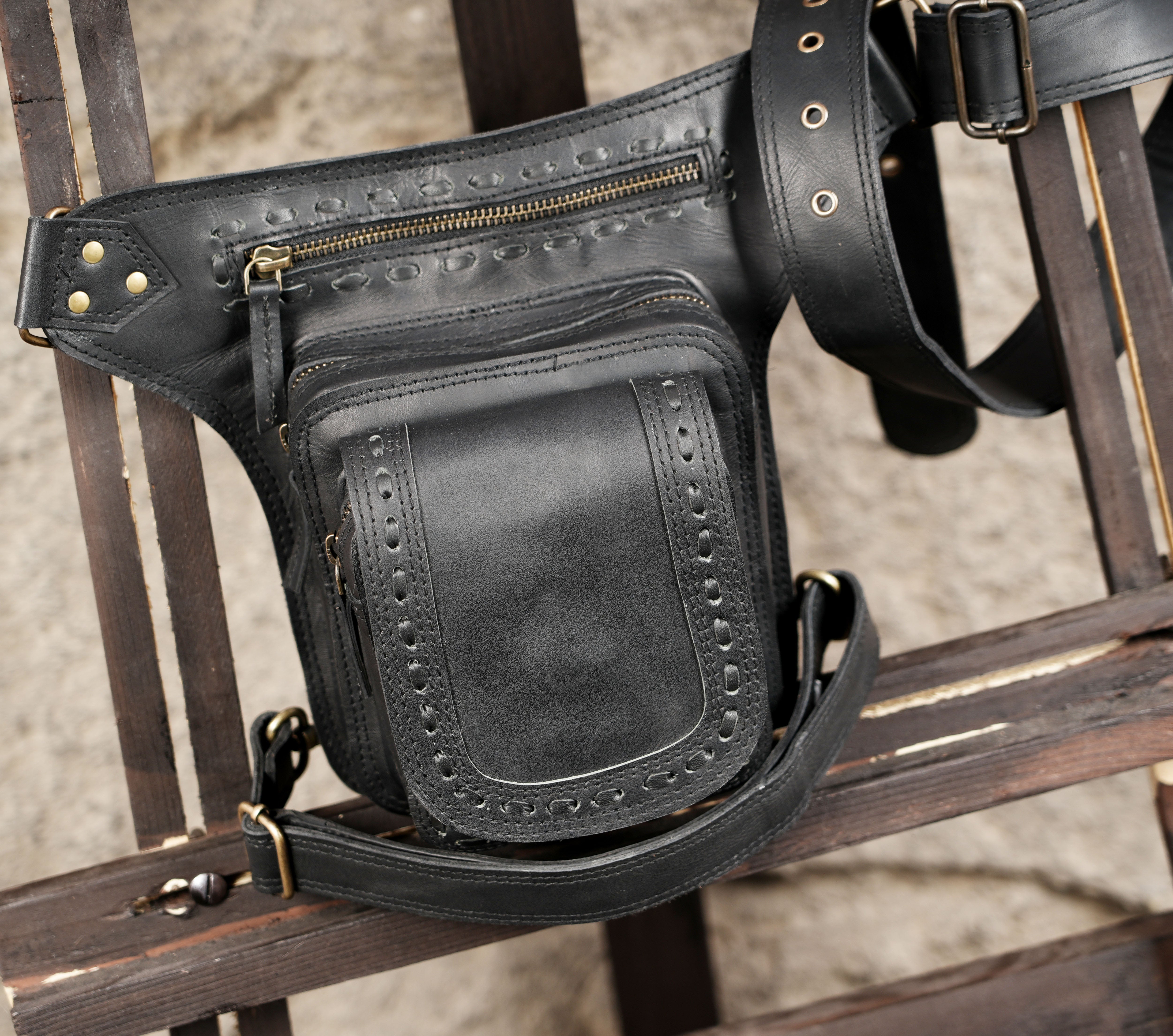 Handcrafted leather thigh bag with adjustable waist and leg straps