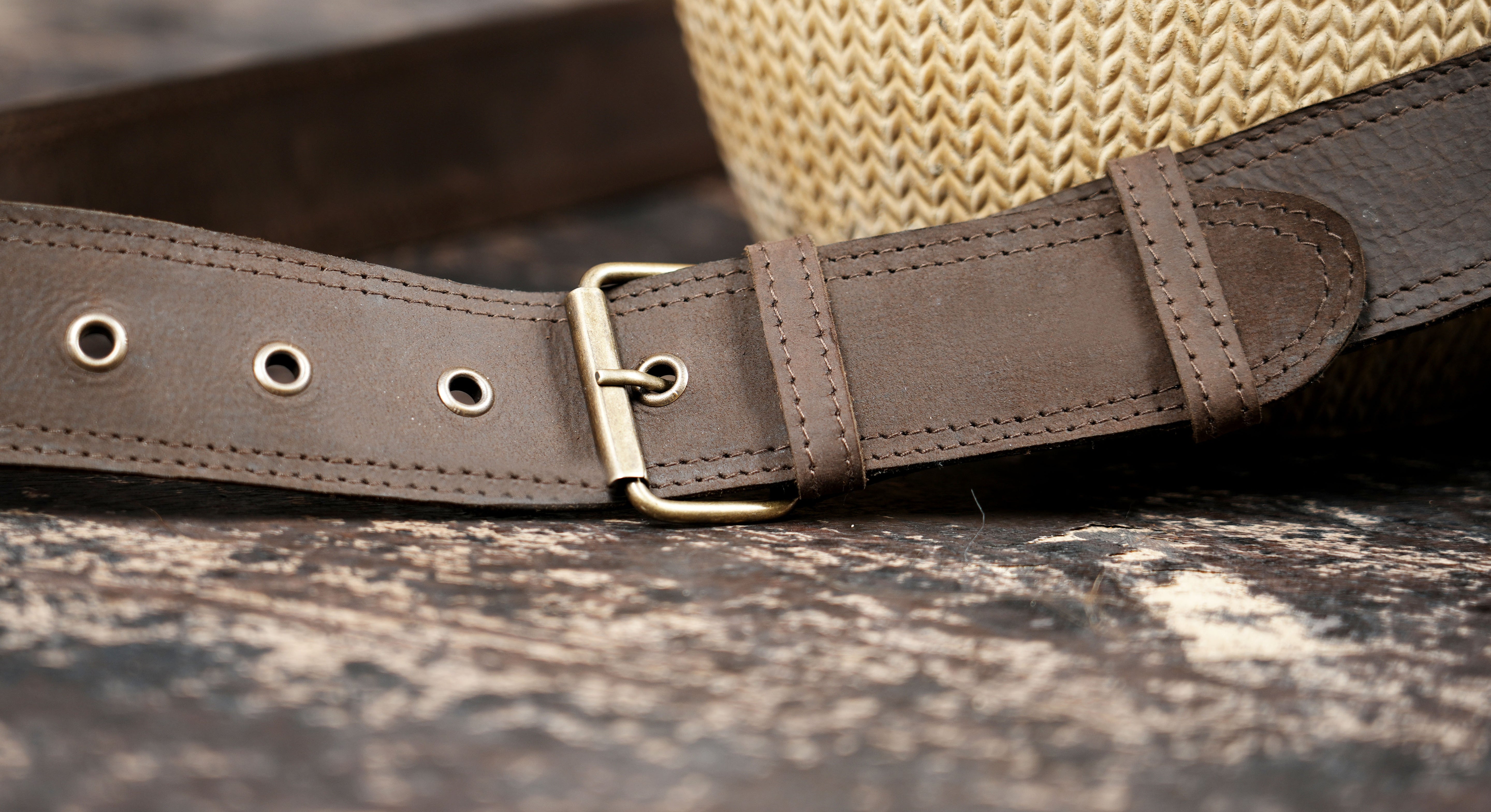 Artisan leather waist bag with metal studs and strong stitching