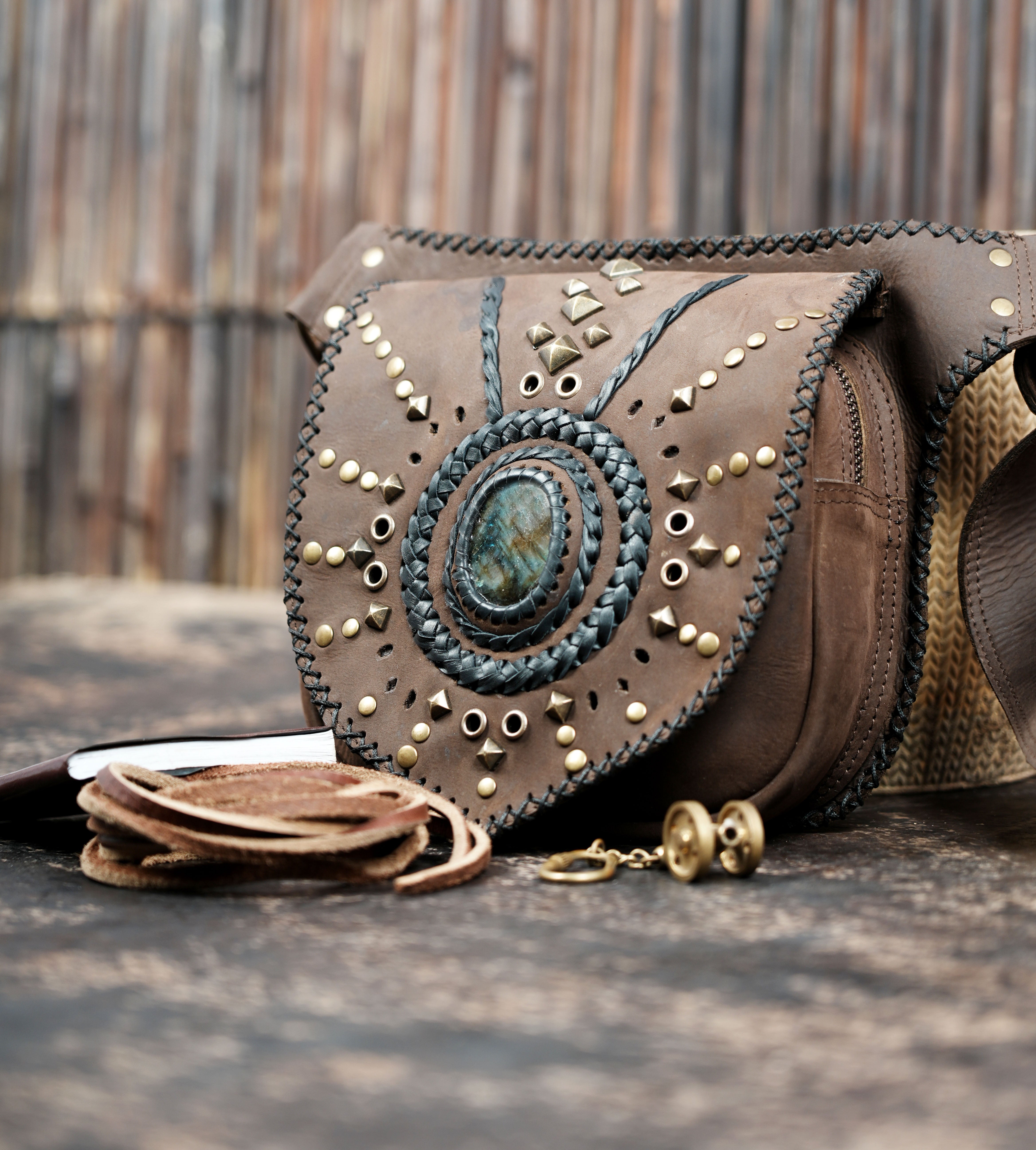 Handcrafted leather belt bag with decorative gemstone center