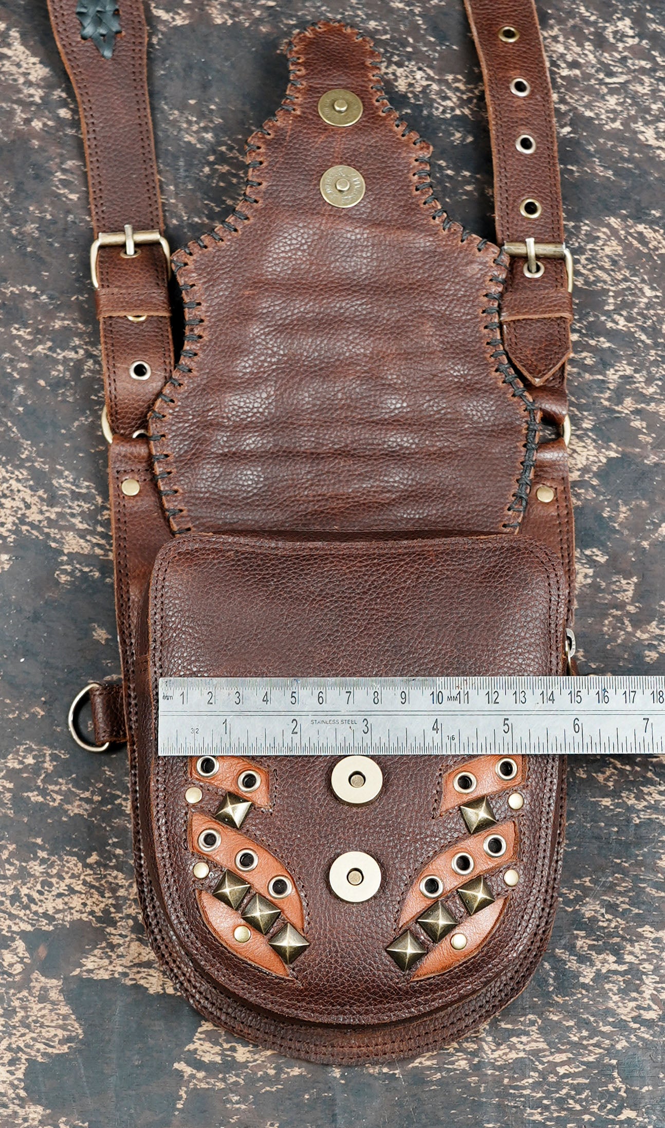 Tribal style leather shoulder holster with dual storage pouches