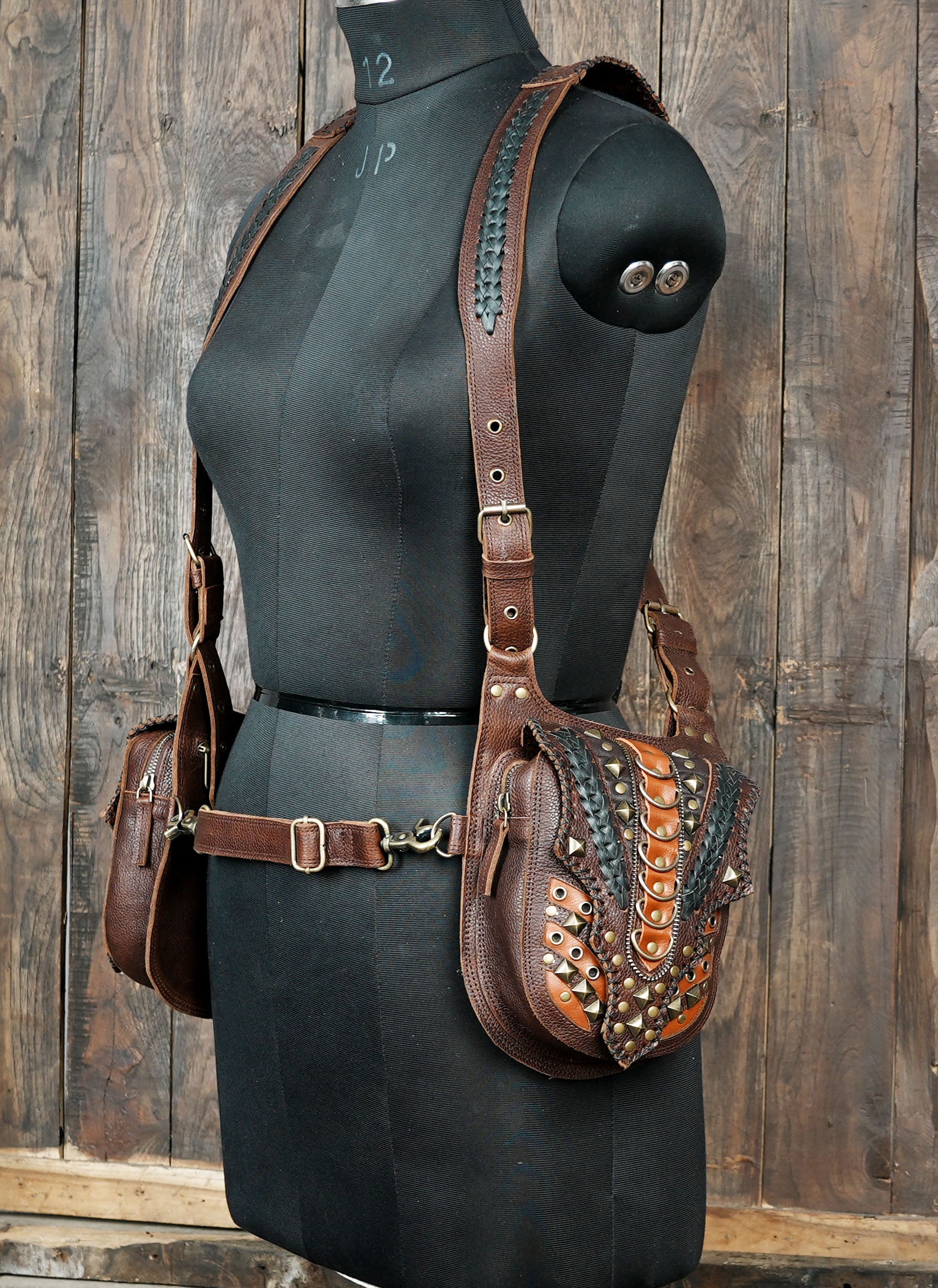 Handcrafted leather holster harness with detailed stud and braid work