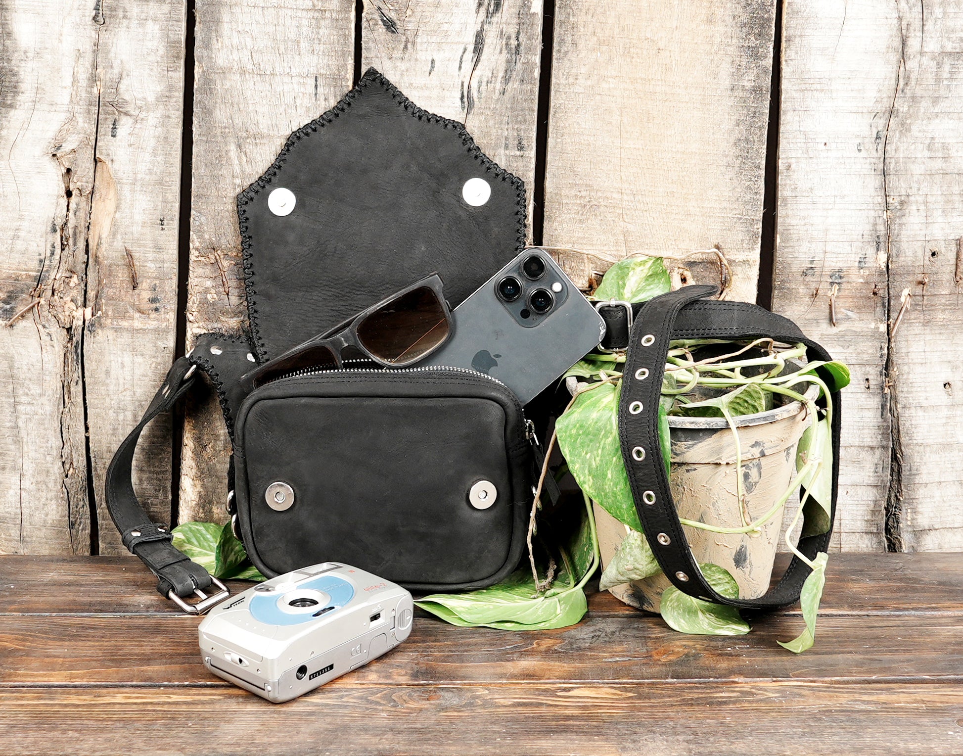 "Fashionable black leather utility bag with textured panels"