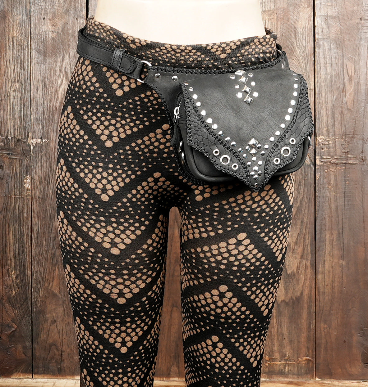"Black leather belt pouch with stylish studded details"