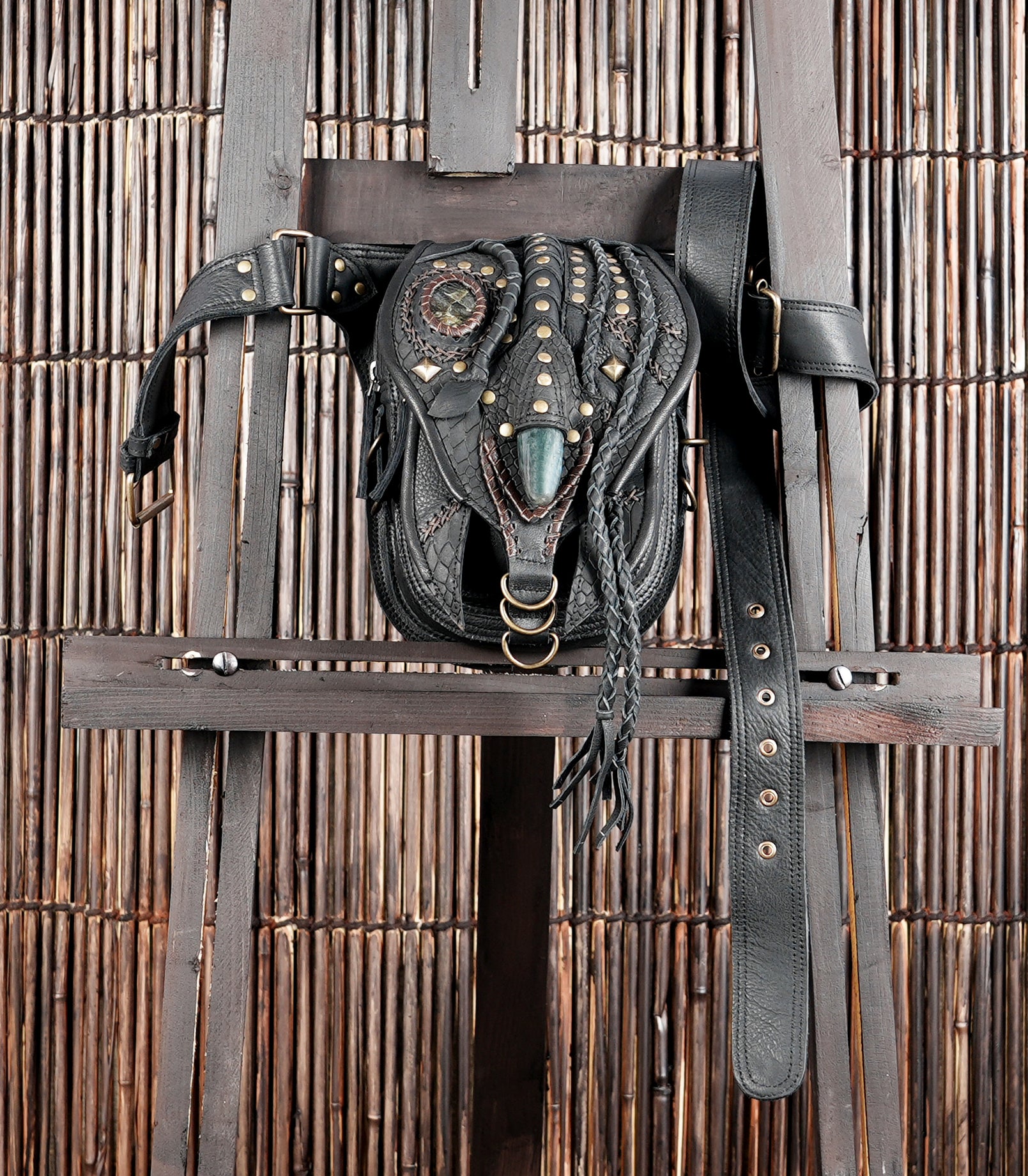 "Steampunk-style leather waist pouch with textured detailing"