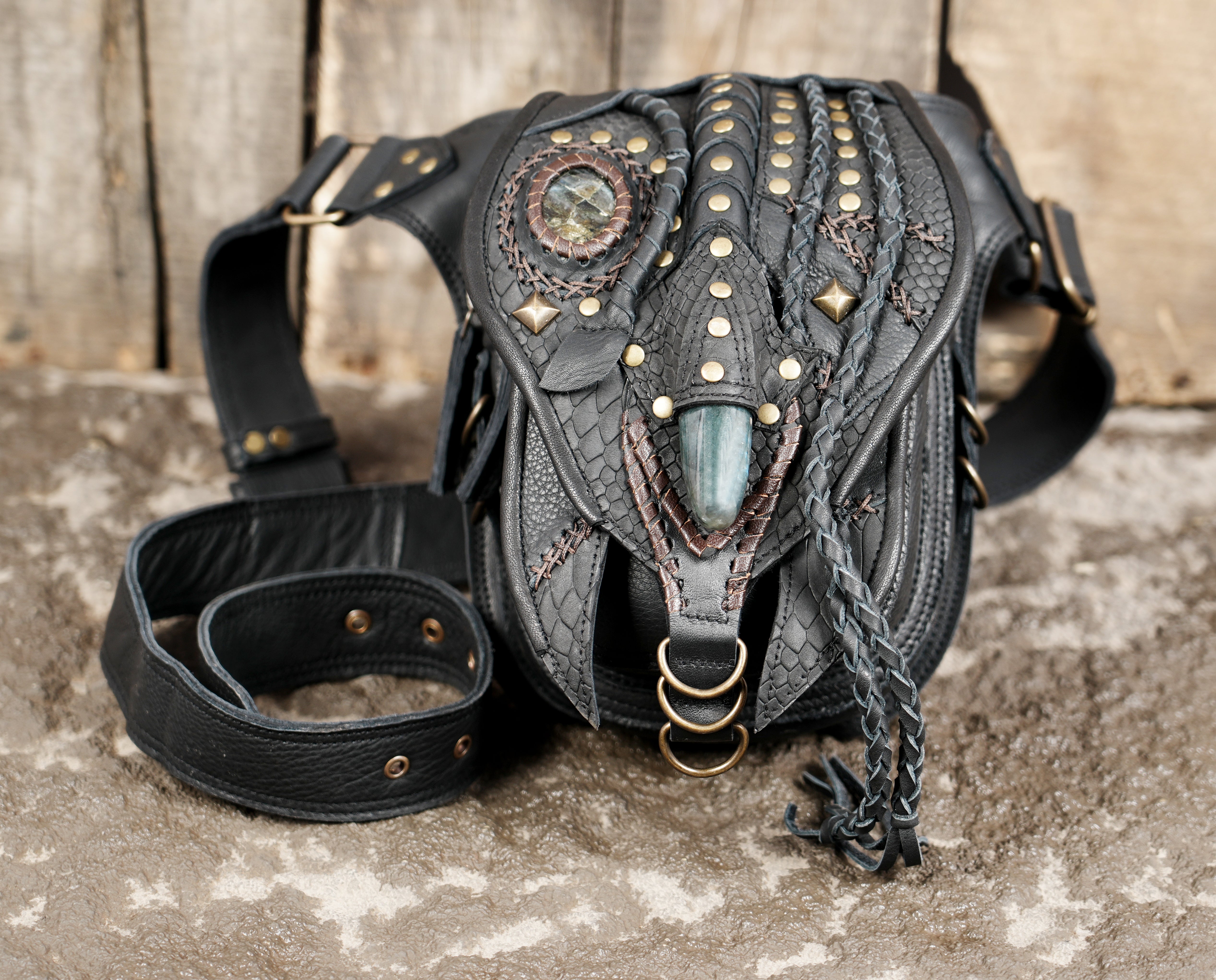 "Leather hip belt with braided tassels and detailed craftsmanship"