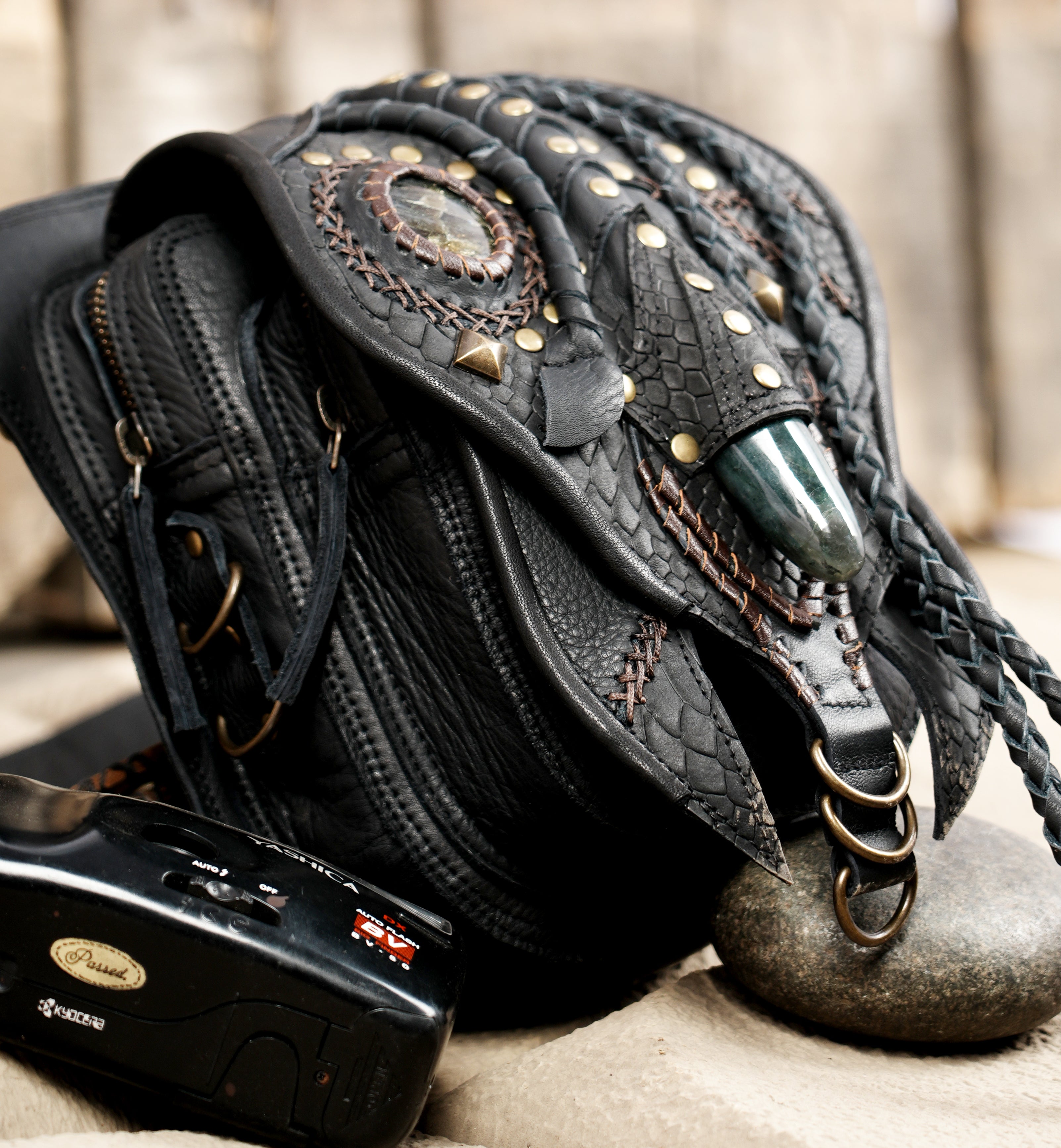 -style leather belt pouch with artistic design elements"