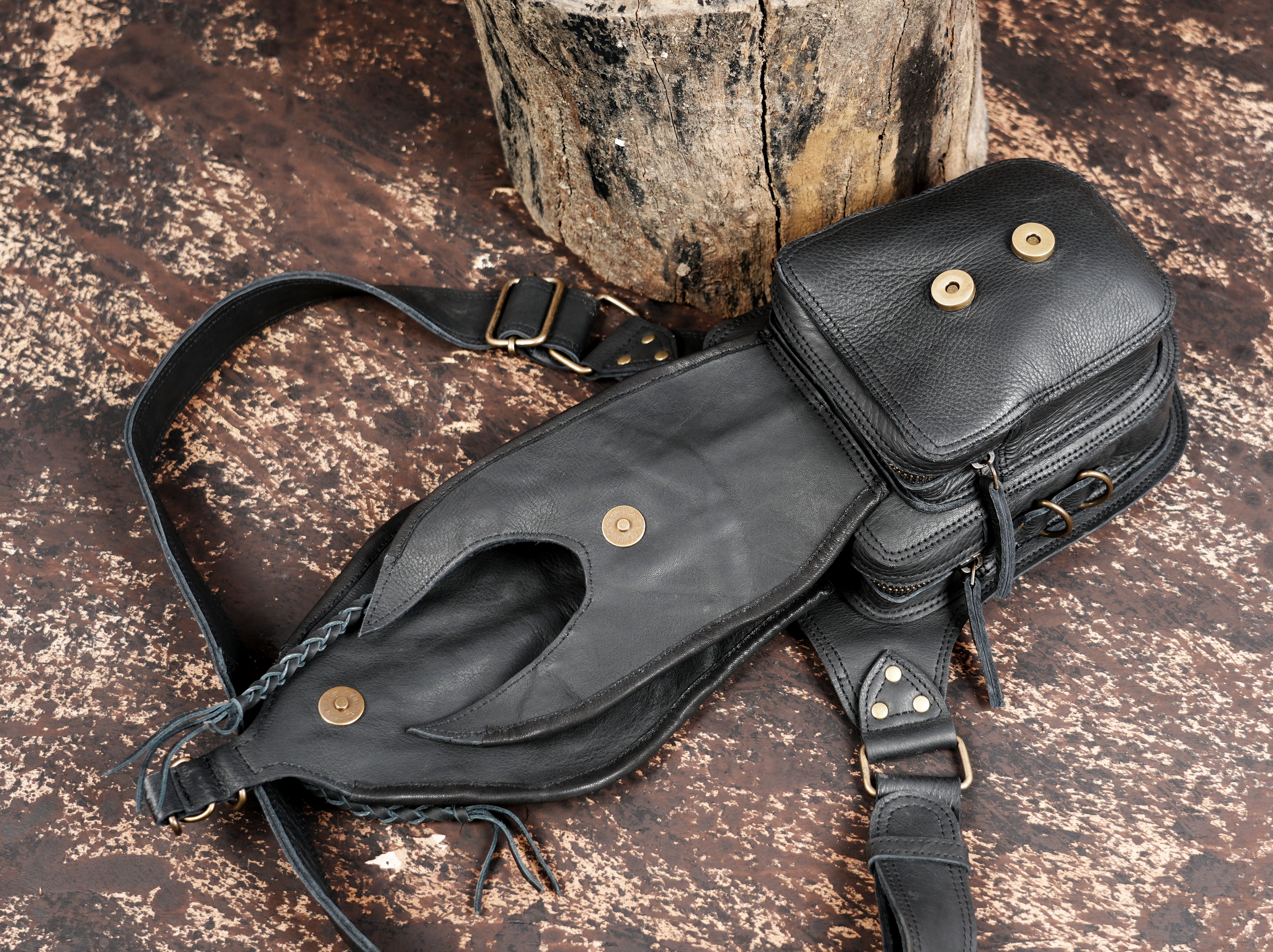 "Leather festival belt bag with embossed patterns and stone accent"