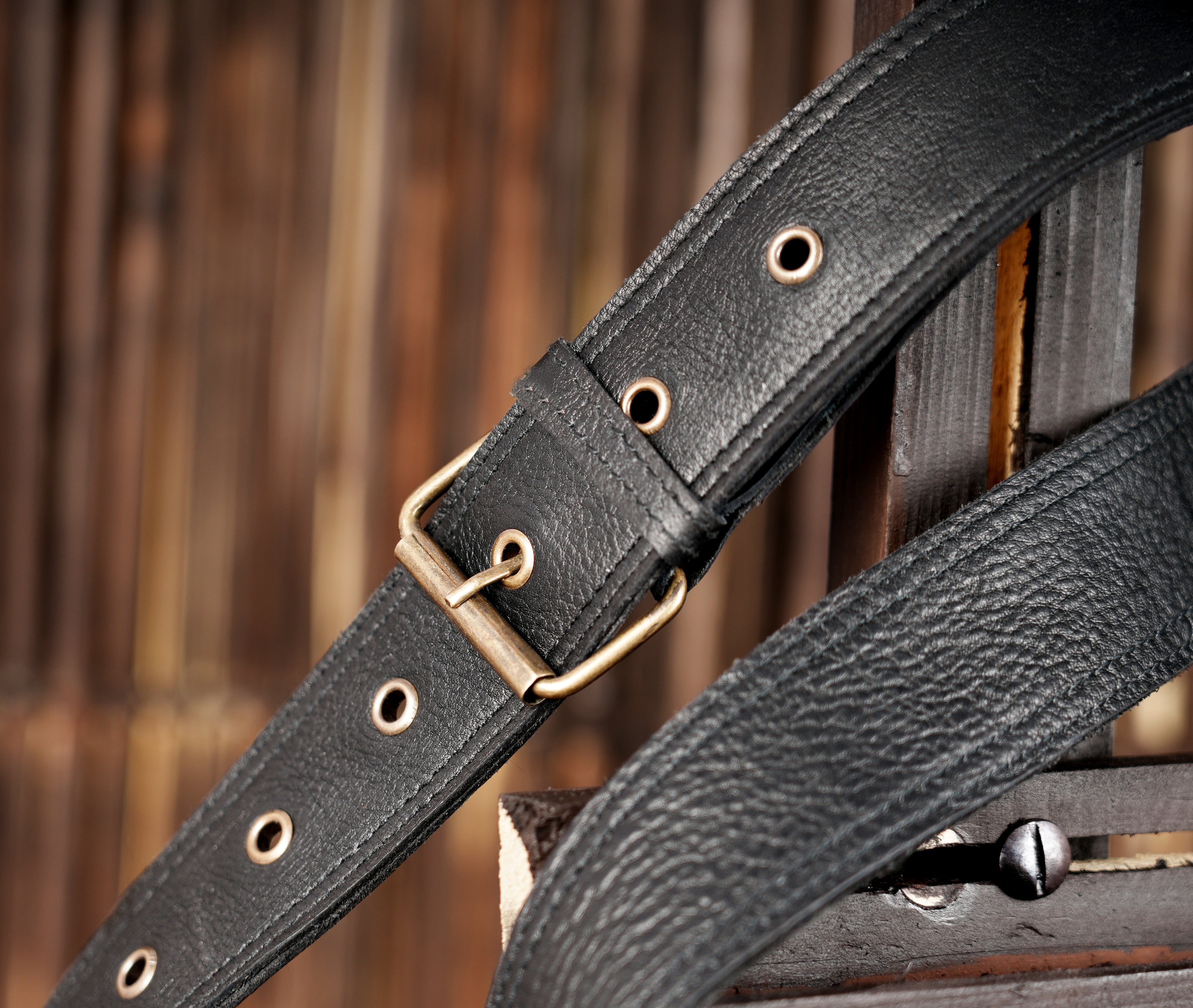 "Adjustable leather belt bag with front pocket and buckles"
