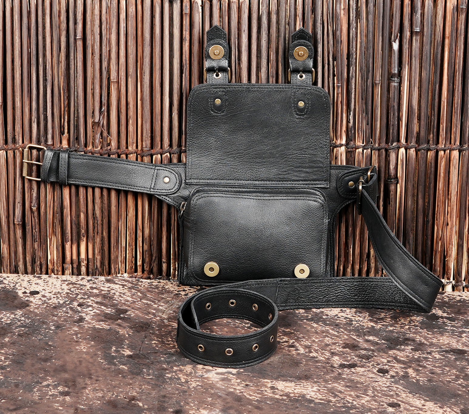 "Everyday black leather hip bag with secure closure"