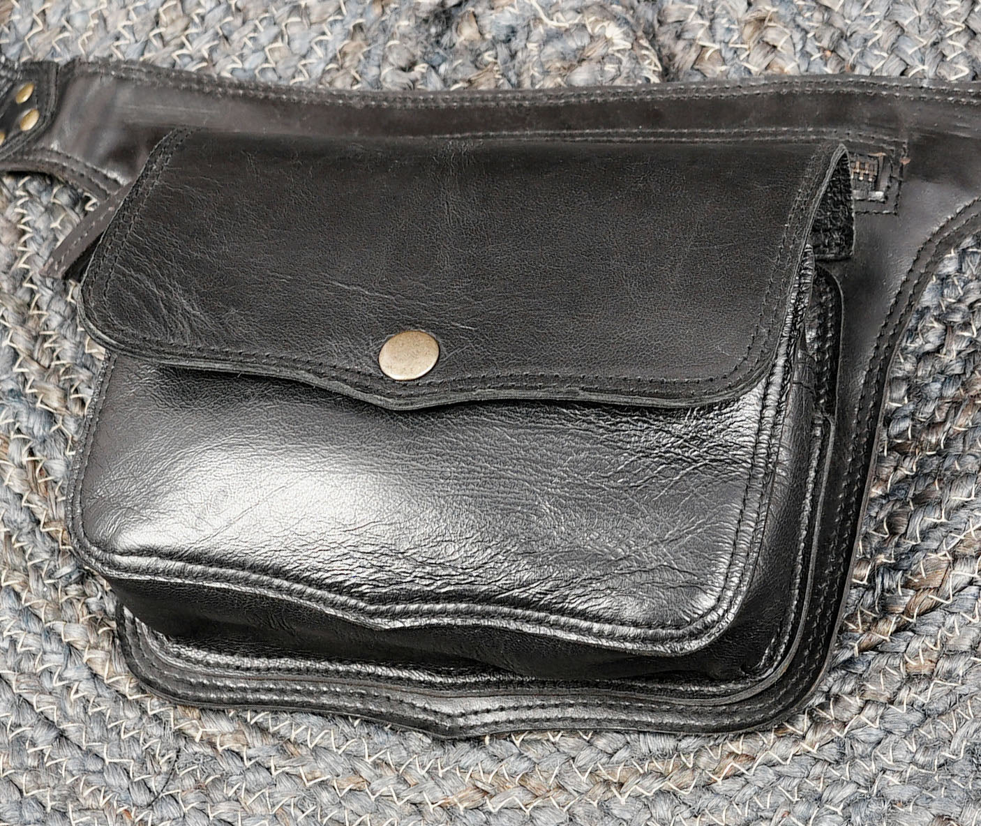 Black leather utility belt with compact snap closure pouch