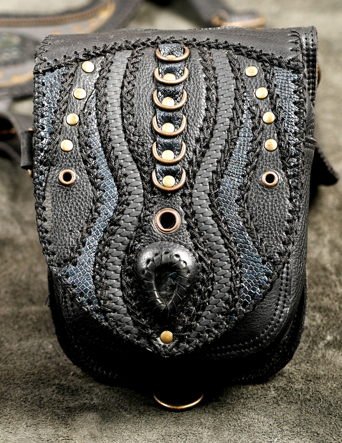 Handcrafted leather shoulder harness bag with dual hanging storage pouches for cyberpunk and edgy fashion looks