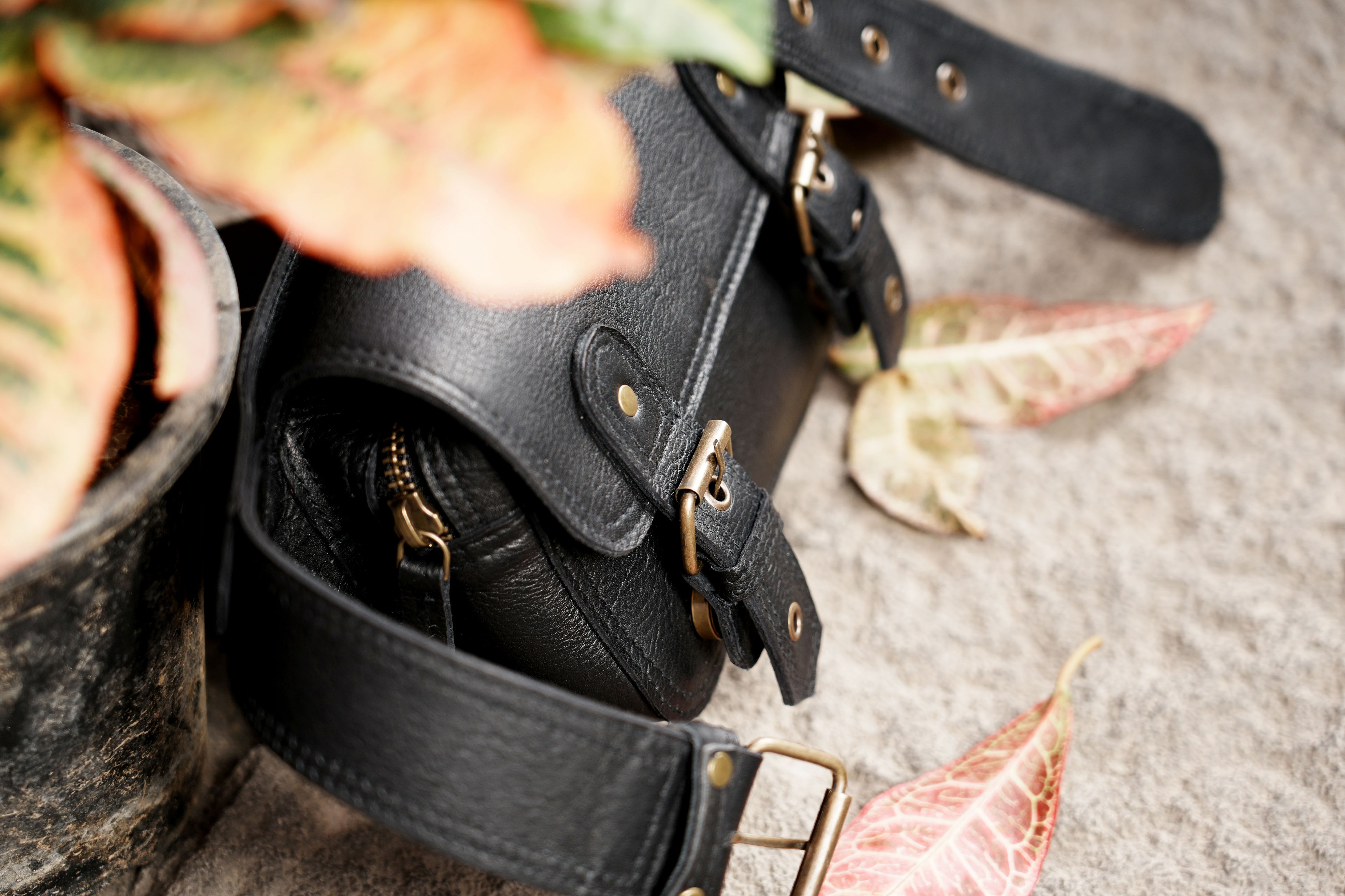 "Durable leather waist bag with secure double-buckle design"