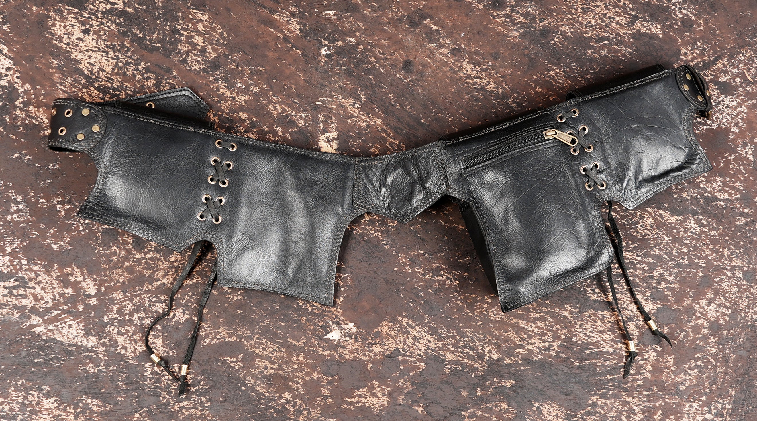 Handmade leather adventure belt with multiple storage pockets