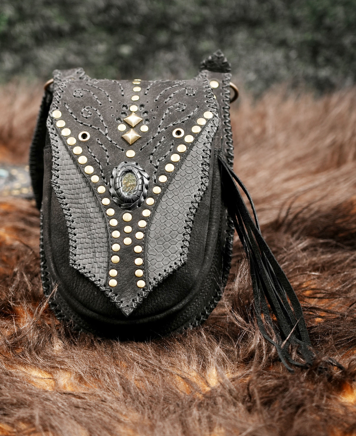 Black leather double leg pouch harness with decorative gemstones and metal stud detailing.