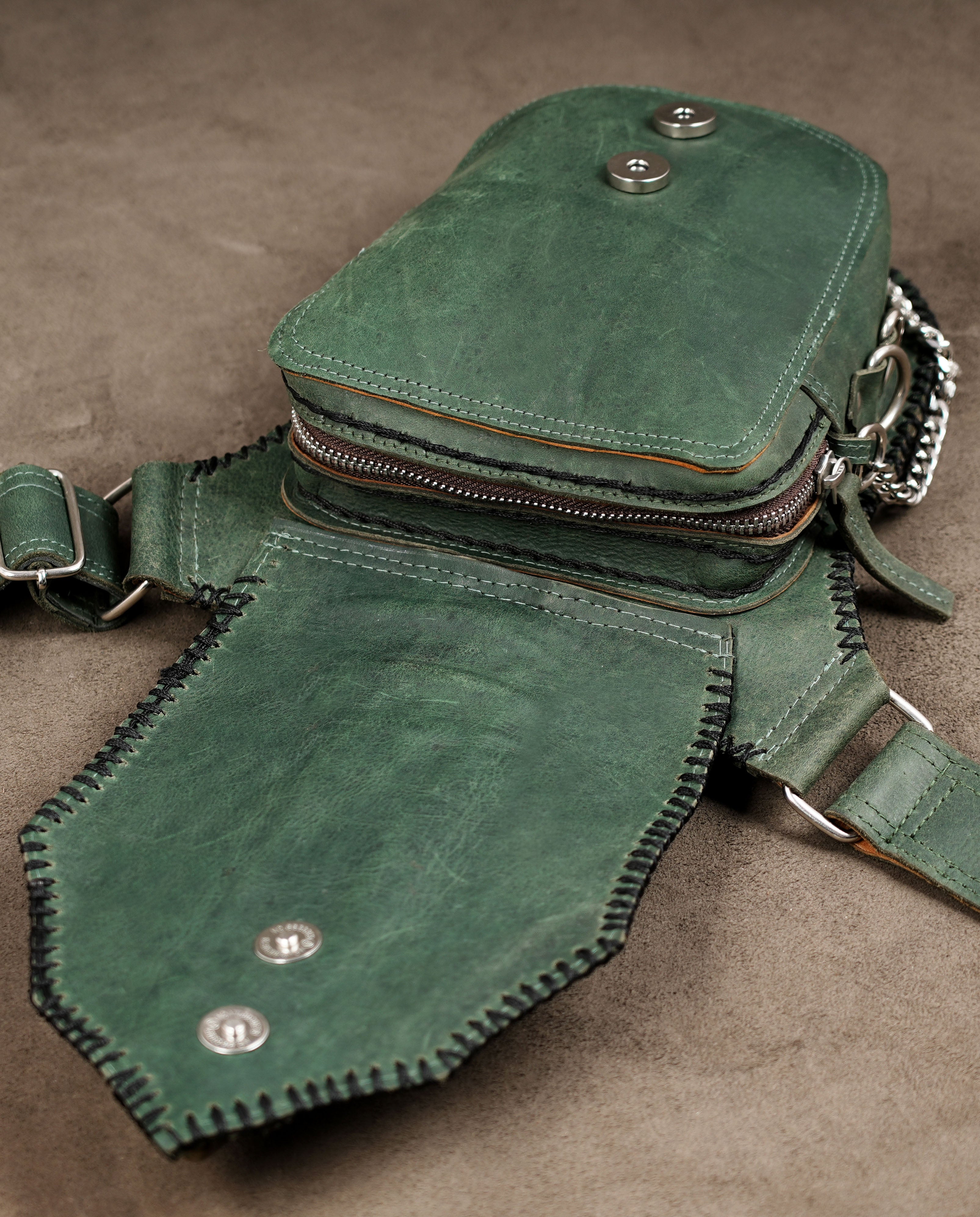 Festival-ready green and black leather hip bag
