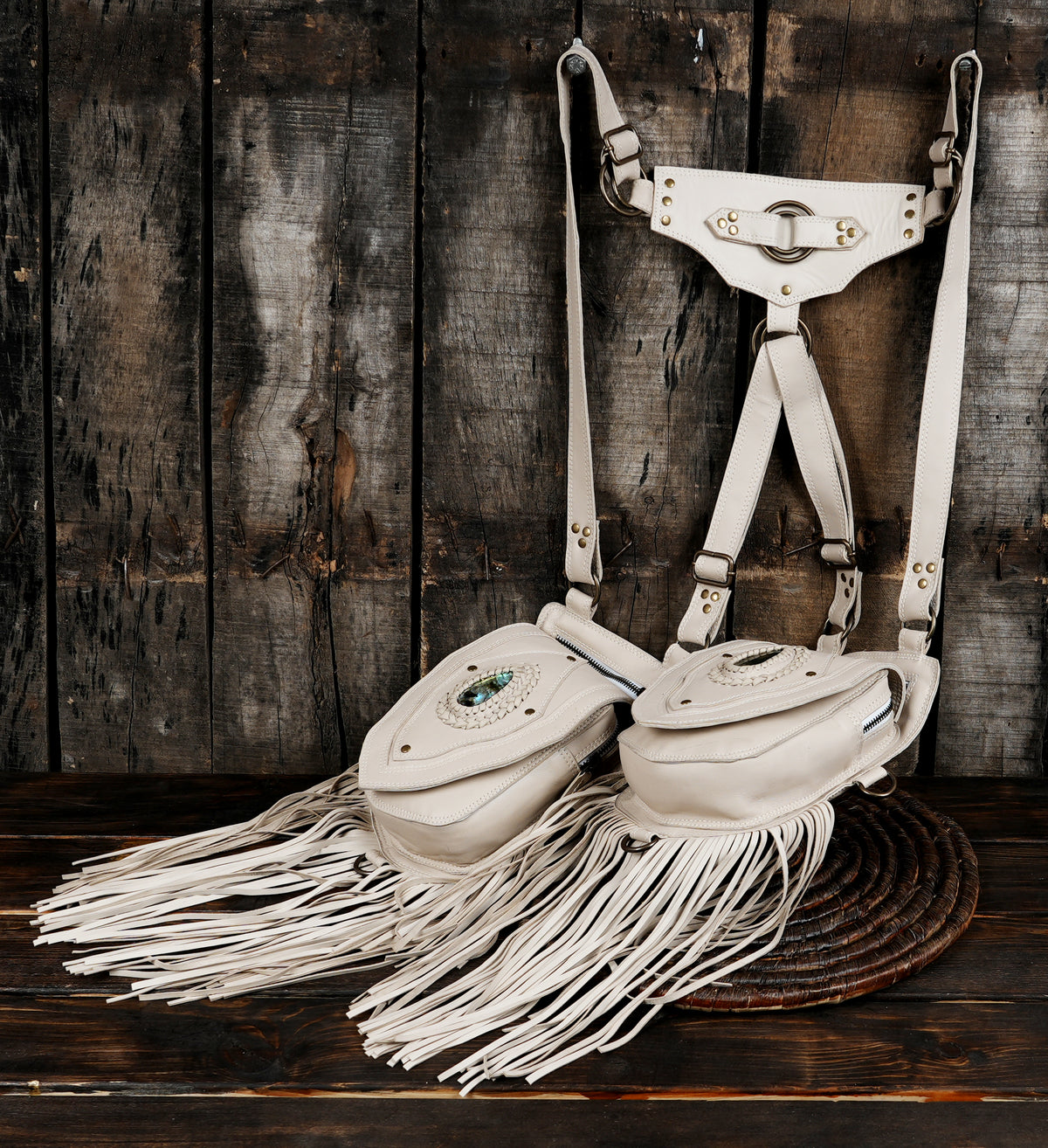 Off-white leather cyberpunk holster bag featuring gemstone embellishments and tassels