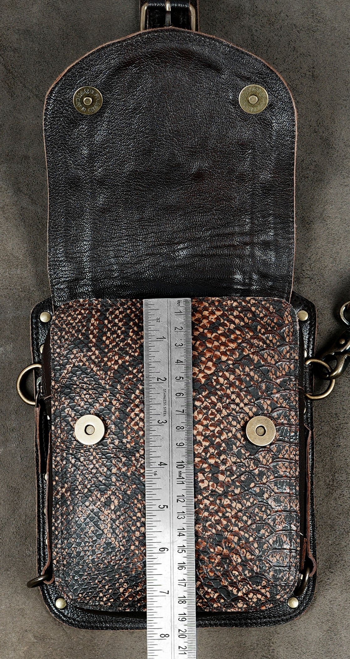 Unisex leather utility shoulder harness with detachable straps and dual pouch storage.