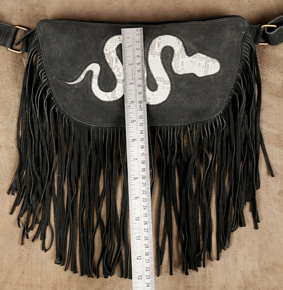 Black Gothic festival pouch with snake motif and textured fringe for edgy outfits.