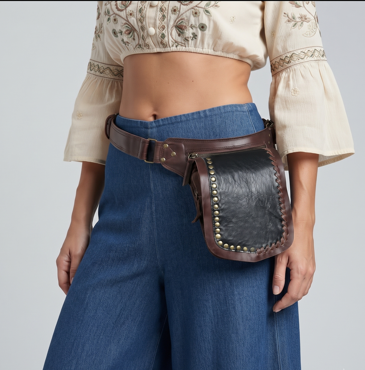 1. Brown leather utility belt with a dark pouch and whipstitch detailing
