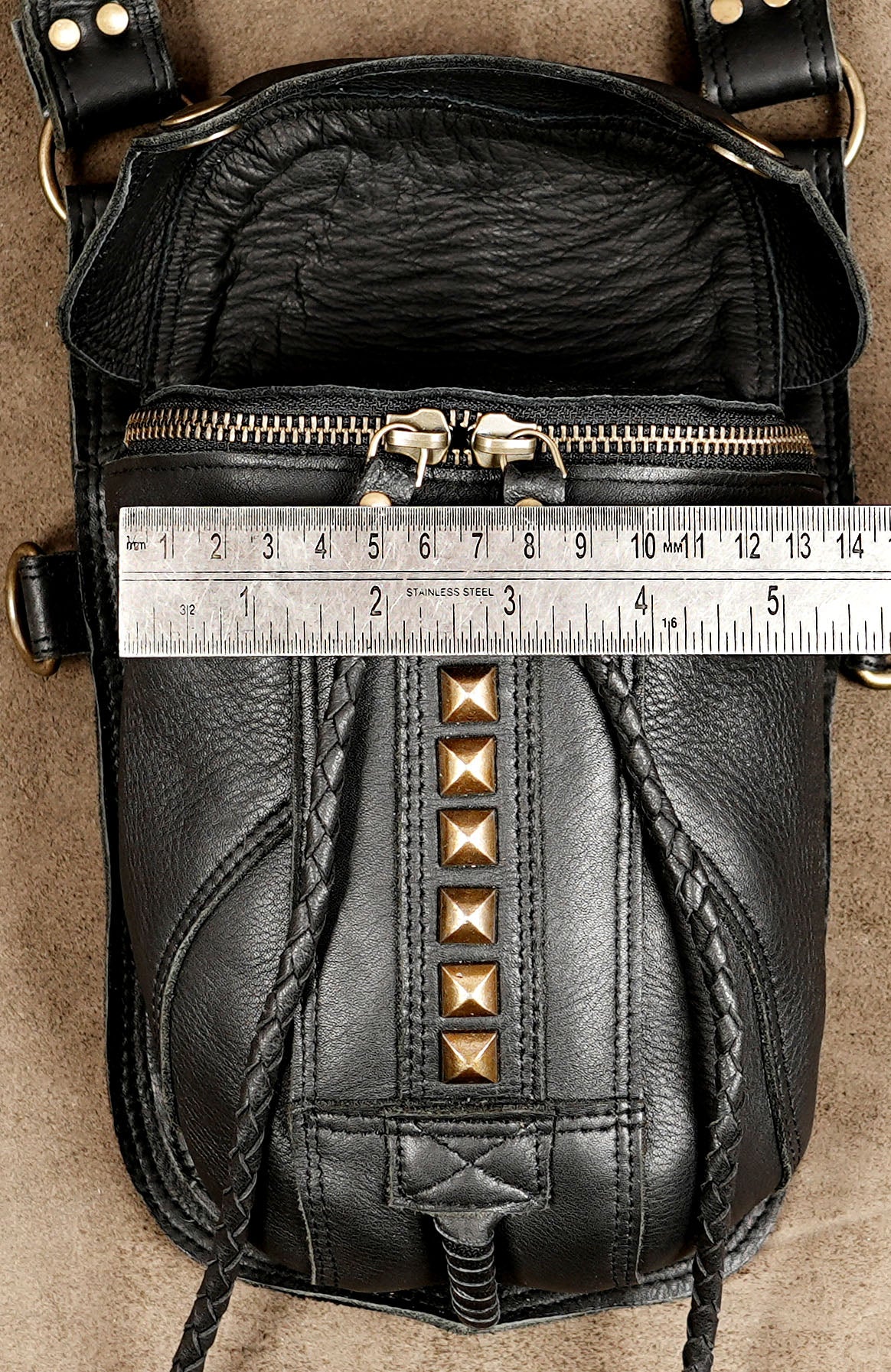 Genuine leather festival holster styled on suede background