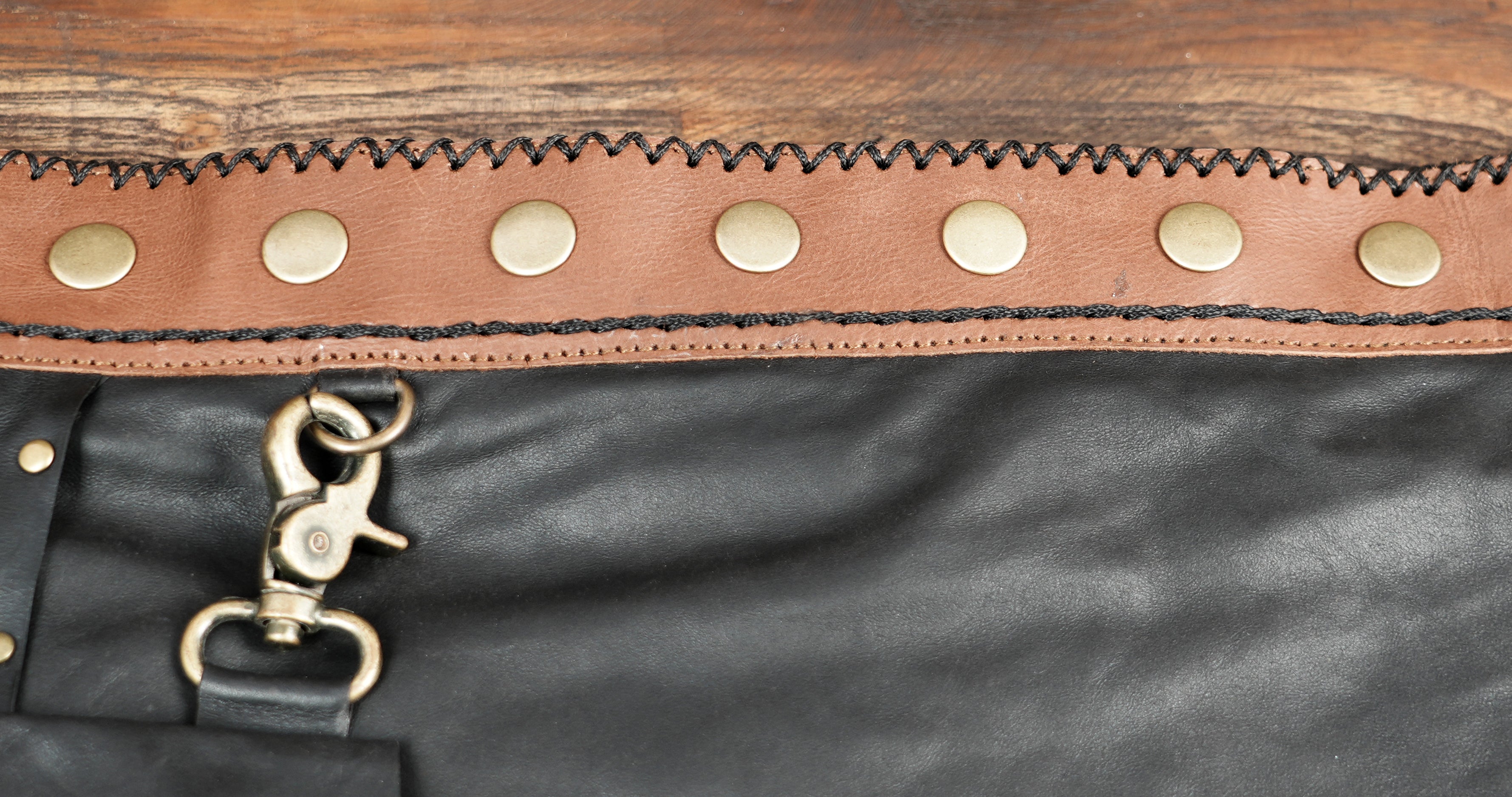 Genuine leather festival skirt styled on wood background