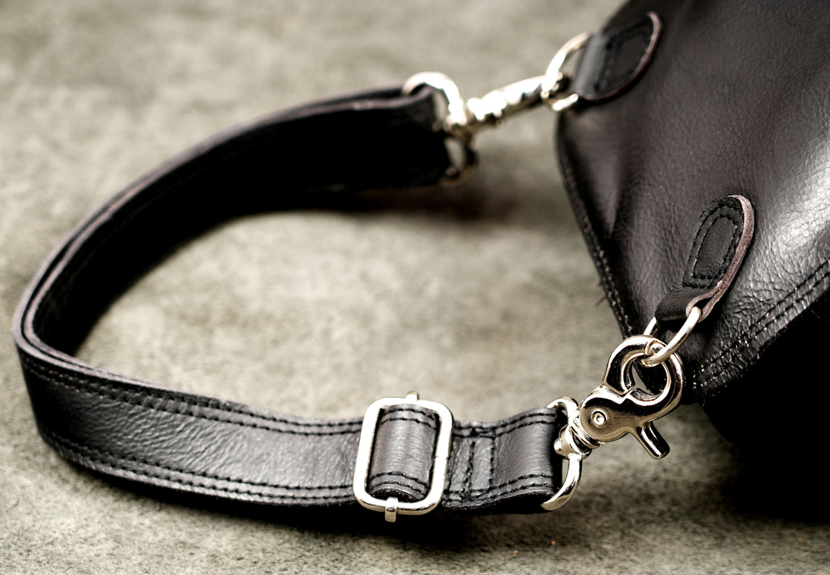 Genuine leather thigh holster styled on stone background