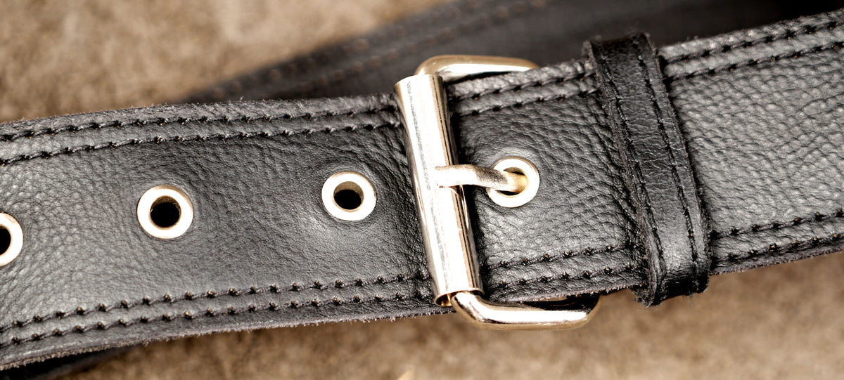 Genuine leather waist bag styled on suede background