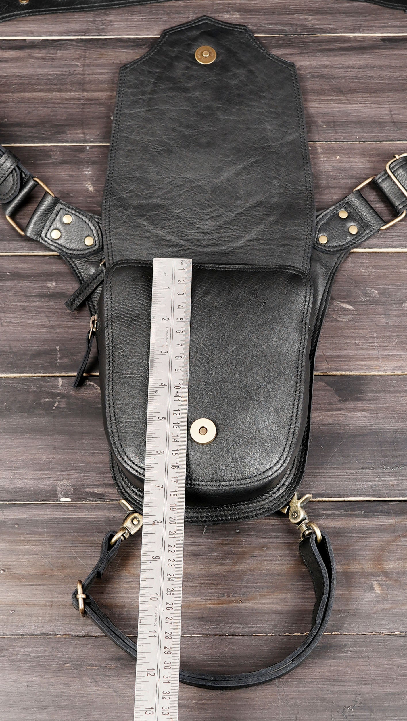 Geometric black leather utility pouch with zipper