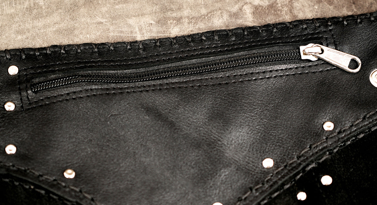Gothic black leather skirt featuring scattered silver studs