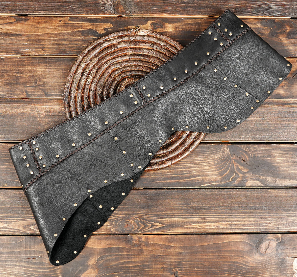 Gothic leather mini skirt with brass hardware detail