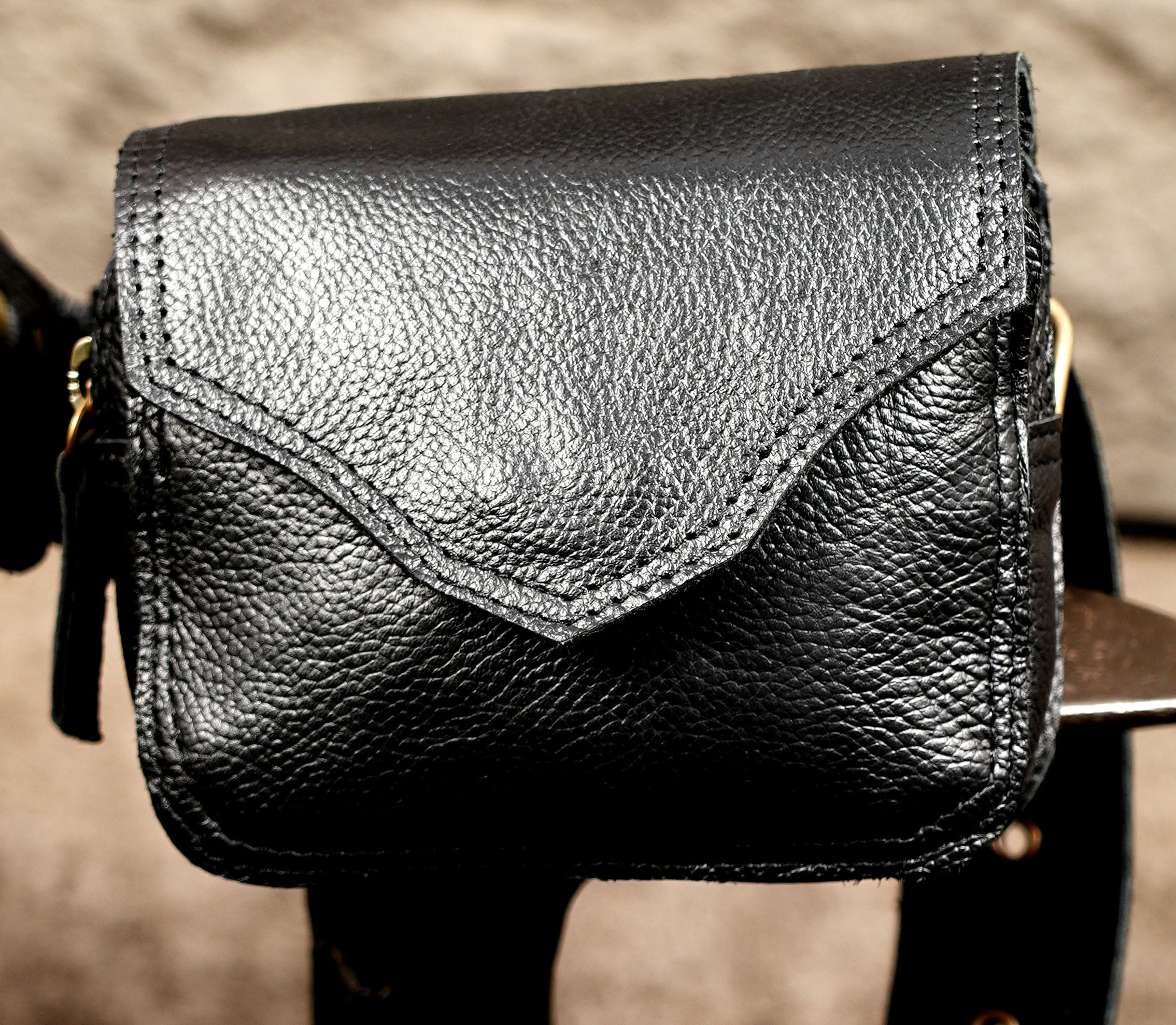 Gothic leather thigh pouch with studs and brass fittings