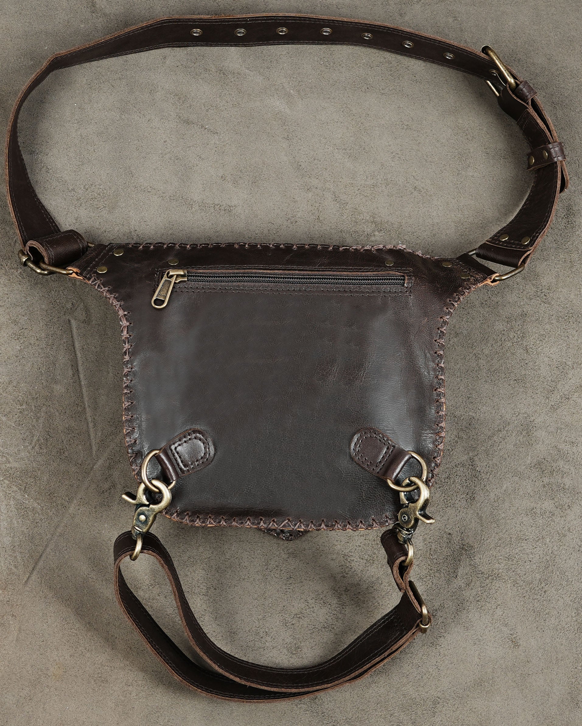 Gothic leather waist bag with decorative metal studs and stitching