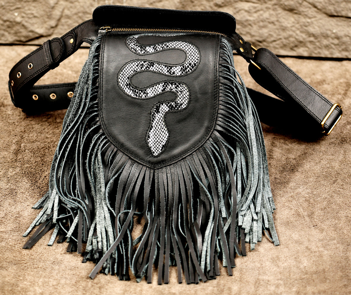 Black leather western belt bag with fringe detail and adjustable strapBlack leather western belt bag with fringe detail and adjustable strap