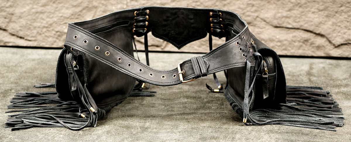 Black handmade leather belt bag with fringe tassels and stone embellishmentsBlack handmade leather belt bag with fringe tassels and stone embellishments