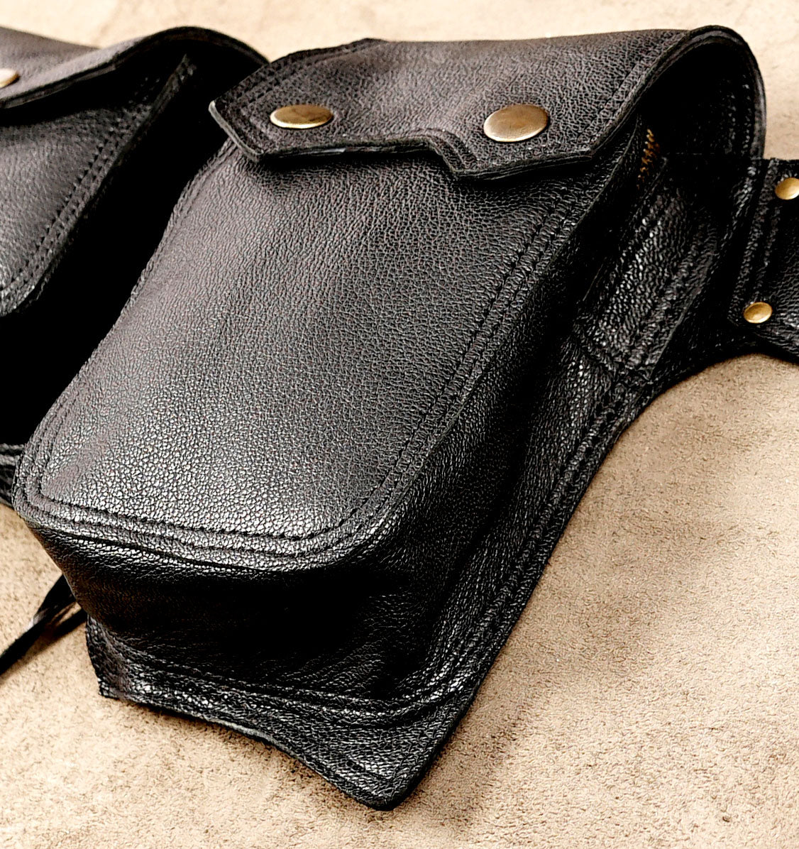 Handcrafted leather belt with corset lace and fringe detail